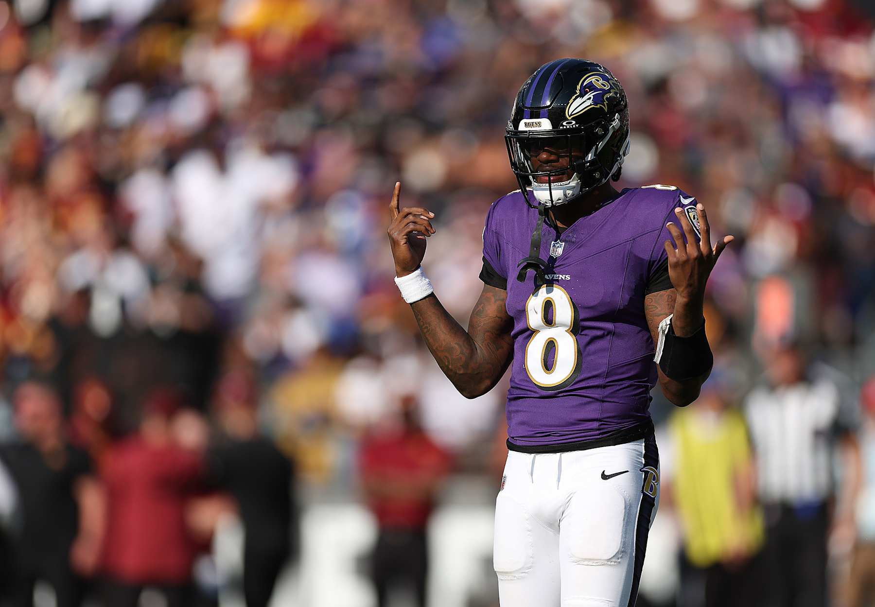 BALTIMORE, MARYLAND - OCTOBER 13: Lamar Jackson #8 of the Baltimore Ravens looks on against the Washington Commanders during the fourth quarter at M&T Bank Stadium on October 13, 2024 in Baltimore, Maryland. (Photo by Rob Carr/Getty Images)
