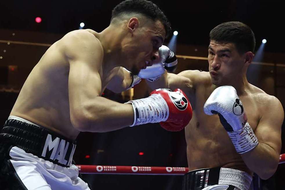 RIYADH, SAUDI ARABIA - JUNE 1: Dmitry Bivol (silver shorts) and Malik Zinad (white and black shorts) exchange punches during their WBA and IBO Light Heavyweight World Title contest on June 1, 2024 in Riyadh, Saudi Arabia. (Photo by Mark Robinson/Matchroom Boxing/Getty Images)