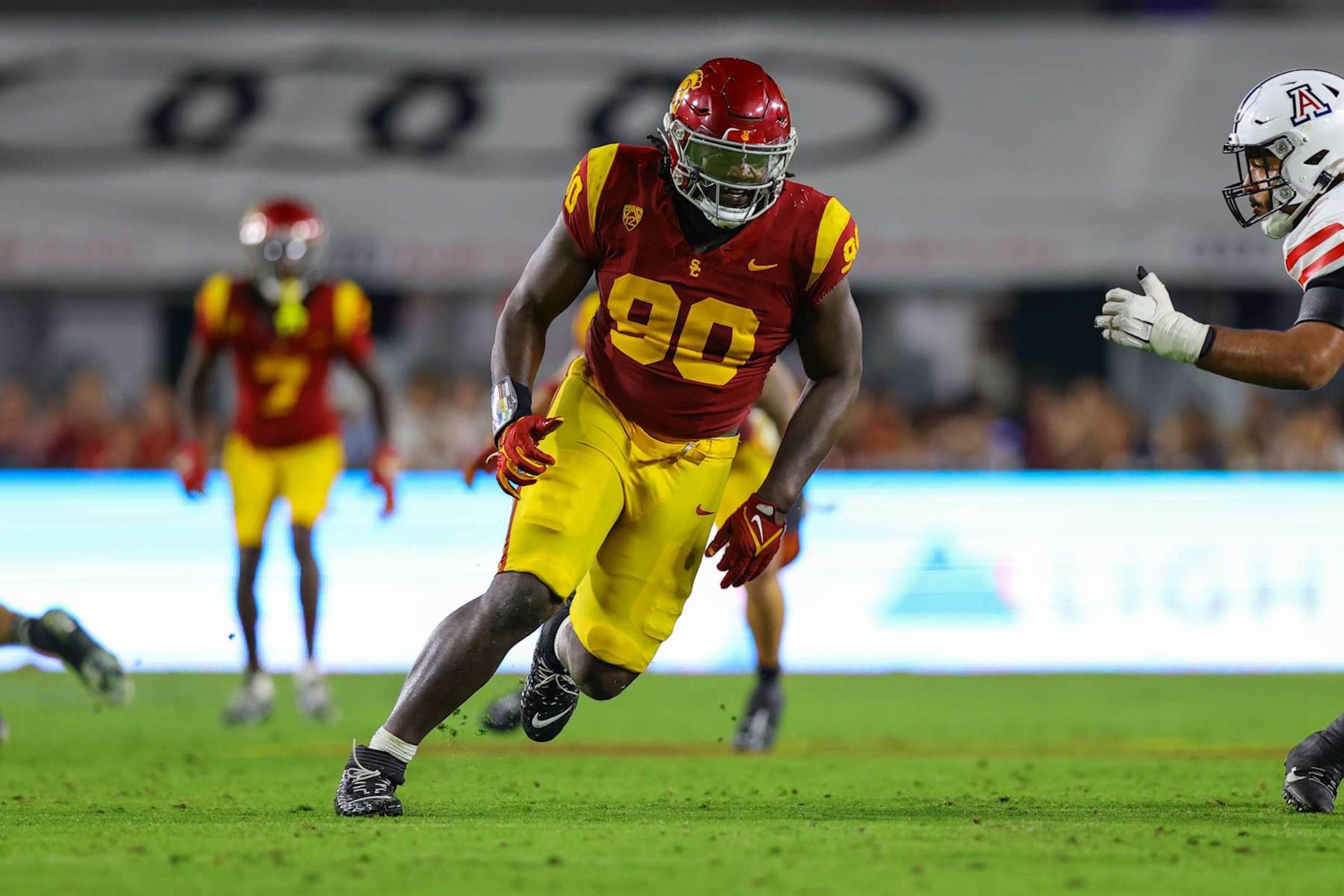 LOS ANGELES, CA - OCTOBER 07: USC Trojans defensive lineman Bear Alexander (90) rushes the passer during a college football game between the Arizona Wildcats against the USC Trojans on October 07, 2023, at United Airlines Field at The Los Angeles Memorial Coliseum in Los Angeles, CA.(Photo by Jordon Kelly/Icon Sportswire via Getty Images) LOS ANGELES, CA - OCTOBER 07: USC Trojans defensive lineman Bear Alexander (90) rushes the passer during a college football game between the Arizona Wildcats against the USC Trojans on October 07, 2023, at United Airlines Field at The Los Angeles Memorial Coliseum in Los Angeles, CA.(Photo by Jordon Kelly/Icon Sportswire via Getty Images)