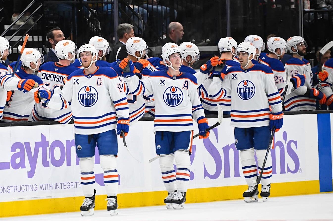 SALT LAKE CITY, UTAH - NOVEMBER 29: Connor McDavid #97, Ryan Nugent-Hopkins #93 and Evan Bouchard #2 of the Edmonton Oilers celebrate a goal during the second period of a game against the Utah Hockey Club at Delta Center on November 29, 2024 in Salt Lake City, Utah. (Photo by Alex Goodlett/Getty Images)