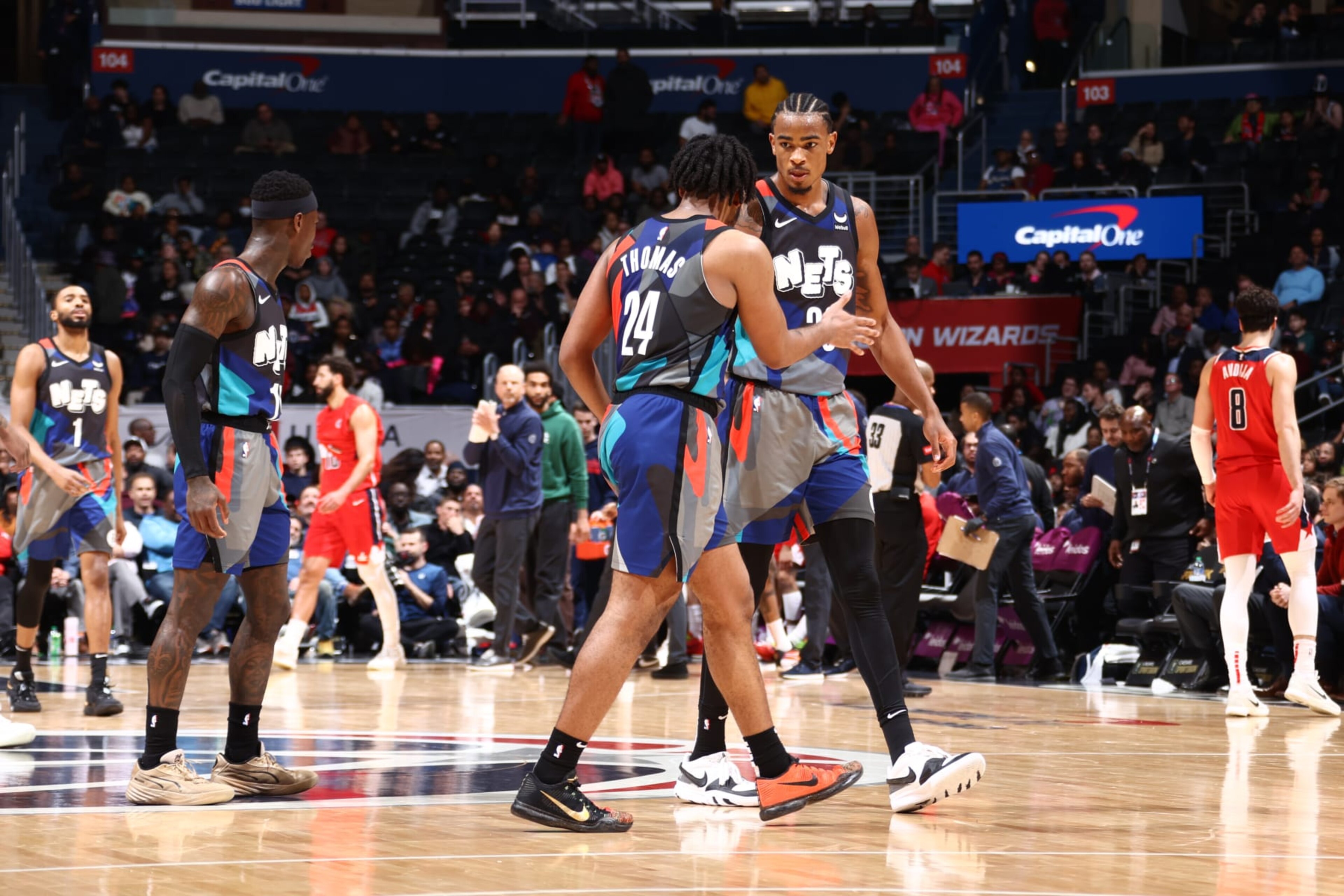 WASHINGTON, DC -  MARCH 27: Nicolas Claxton #33 high fives  Cam Thomas #24 of the Brooklyn Nets during the game against the Washington Wizards on March 27, 2024 NBAE at Capital One Arena in Washington, DC. NOTE TO USER: User expressly acknowledges and agrees that, by downloading and or using this Photograph, user is consenting to the terms and conditions of the Getty Images License Agreement. Mandatory Copyright Notice: Copyright 2024 NBAE (Photo by Kenny Giarla/NBAE via Getty Images)
