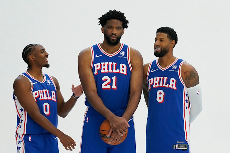 (L-R) Philadelphia 76ers guard Tyrese Maxey, center Joel Embiid and small forward Paul George pose for photos during the 76ers media day ahead of the NBA season at the 76ers Training Complex in Camden, New Jersey, September 30, 2024. (Photo by TIMOTHY A. CLARY / AFP) (Photo by TIMOTHY A. CLARY/AFP via Getty Images)