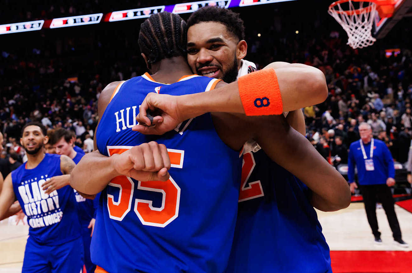 TORONTO, CANADA - FEBRUARY 4: Karl-Anthony Towns #32 of the New York Knicks hugs Ariel Hukporti #55 after the NBA game against the Toronto Raptors at Scotiabank Arena on February 4, 2025 in Toronto, Canada. NOTE TO USER: User expressly acknowledges and agrees that, by downloading and or using this photograph, User is consenting to the terms and conditions of the Getty Images License Agreement. (Photo by Cole Burston/Getty Images)