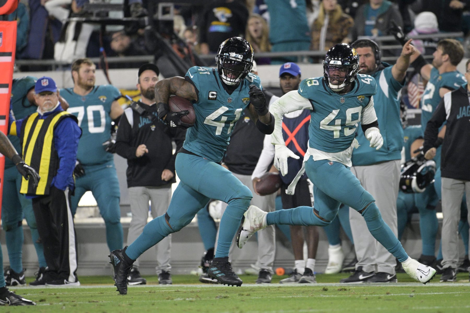 Jacksonville Jaguars linebacker Josh Allen (41) returns a fumble for a touchdown in the second half of an NFL football game against the Tennessee Titans, Saturday, Jan. 7, 2023, in Jacksonville, Fla. (AP Photo/Phelan M. Ebenhack)