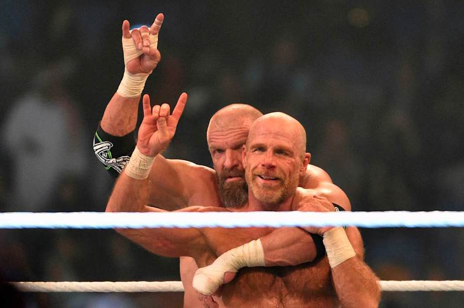 Shawn Michaels (R) and Triple H, of D-Generation X, celebrate their win during a tag team match as part of as part of the World Wrestling Entertainment (WWE) Crown Jewel pay-per-view at the King Saud University Stadium in Riyadh on November 2, 2018. (Photo by Fayez Nureldine / AFP) (Photo credit should read FAYEZ NURELDINE/AFP via Getty Images)