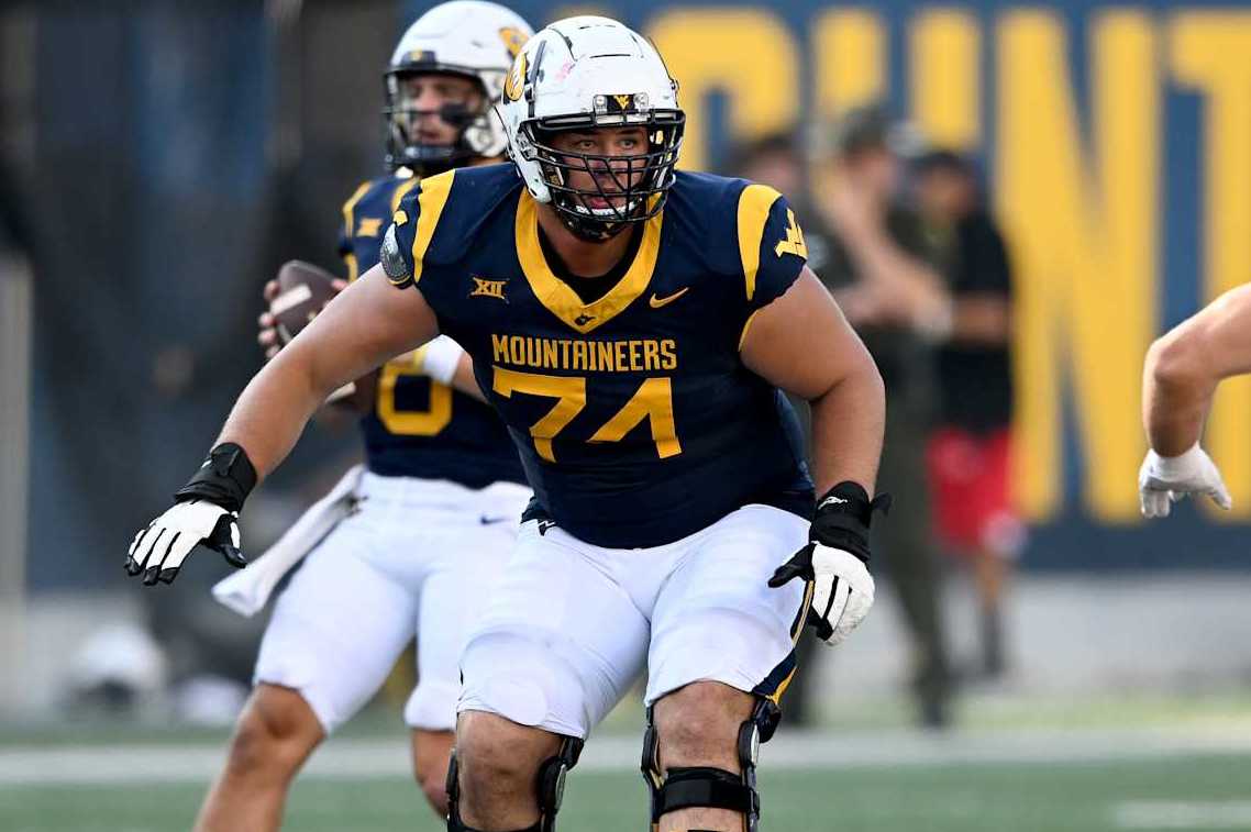 MORGANTOWN, WEST VIRGINIA - SEPTEMBER 21: Wyatt Milum #74 of the West Virginia Mountaineers blocks against the Kansas Jayhawks at Milan Puskar Stadium on September 21, 2024 in Morgantown, West Virginia. (Photo by G Fiume/Getty Images)