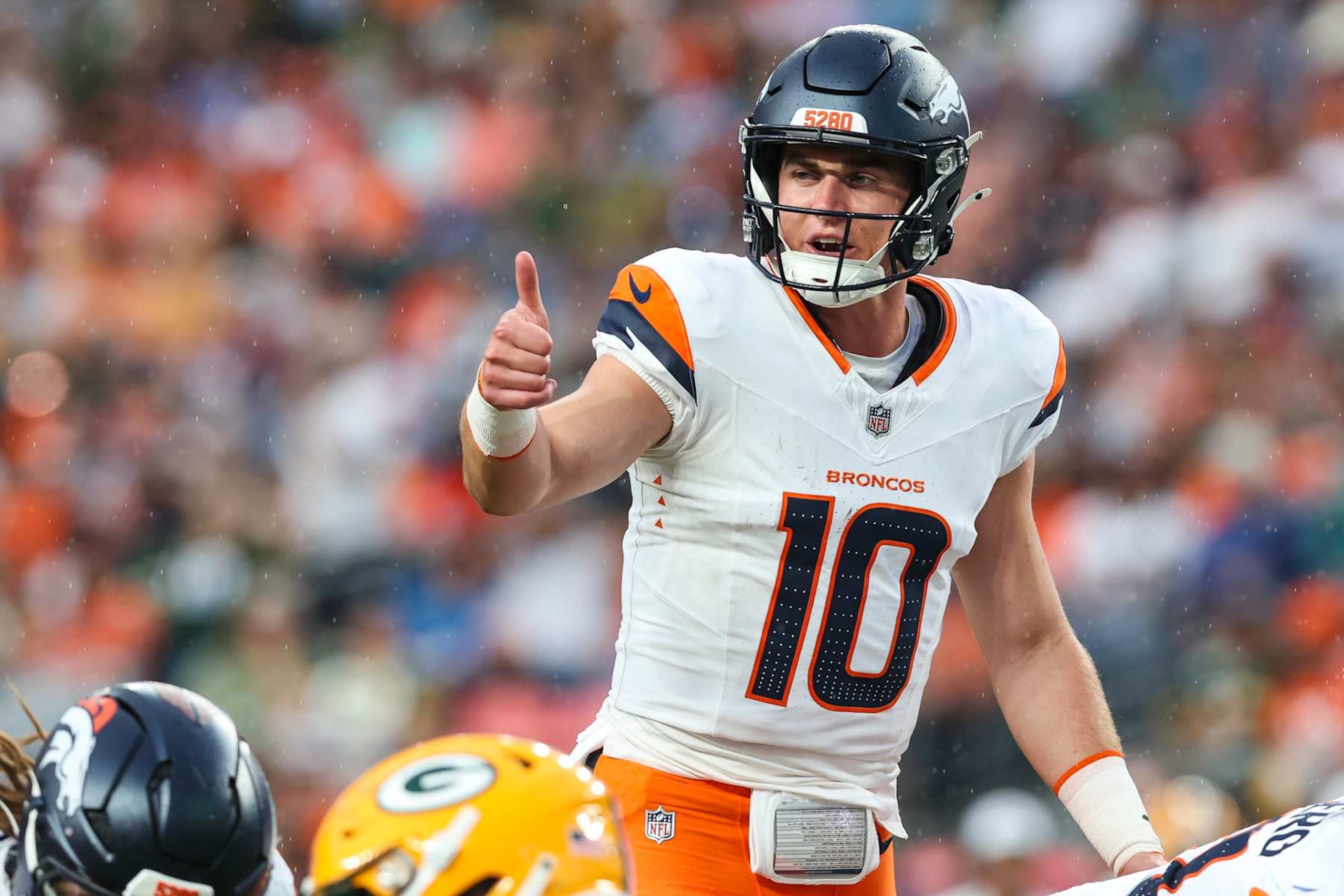 DENVER, CO - AUGUST 18: Bo Nix #10 of the Denver Broncos makes a call during an NFL football game against the Green Bay Packers at Empower Field at Mile High on August 18, 2024 in Denver, CO. (Photo by Perry Knotts/Getty Images) DENVER, CO - AUGUST 18: Bo Nix #10 of the Denver Broncos makes a call during an NFL football game against the Green Bay Packers at Empower Field at Mile High on August 18, 2024 in Denver, CO. (Photo by Perry Knotts/Getty Images)