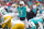 MIAMI GARDENS, FLORIDA - DECEMBER 25: Tua Tagovailoa #1 of the Miami Dolphins signals at the line of scrimmage during the first quarter of the game against the Green Bay Packers at Hard Rock Stadium on December 25, 2022 in Miami Gardens, Florida. (Photo by Megan Briggs/Getty Images)