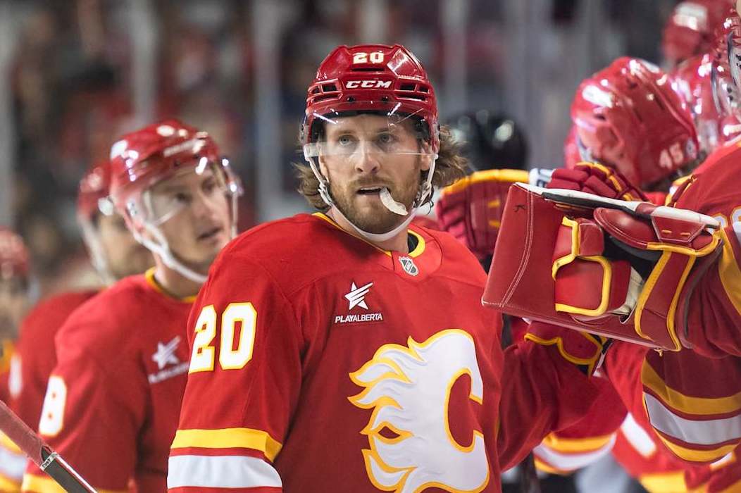 CALGARY, AB - SEPTEMBER 30: Calgary Flames Right Wing Blake Coleman (20) celebrates a goal with teammates during the first period of an NHL preseason game between the Calgary Flames and the Seattle Kraken on September 30, 2024, at the Scotiabank Saddledome in Calgary, AB. (Photo by Brett Holmes/Icon Sportswire via Getty Images)