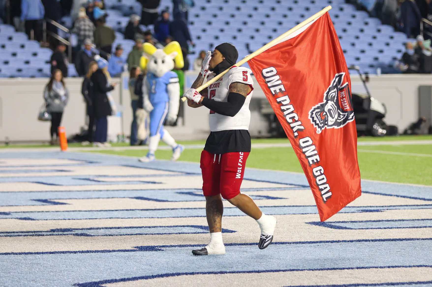 CHAPEL HILL, NC - NOVEMBER 30: North Carolina State Wolfpack safety DK Kaufman (5) blows a kiss to the remaining North Carolina Tar Heels fans after winning the college basketball game between the North Carolina Tar Heels and the North Carolina State Wolfpack on November 30, 2024 at Kenan Memorial Stadium in Chapel Hill, NC. (Photo by Nicholas Faulkner/Icon Sportswire via Getty Images)