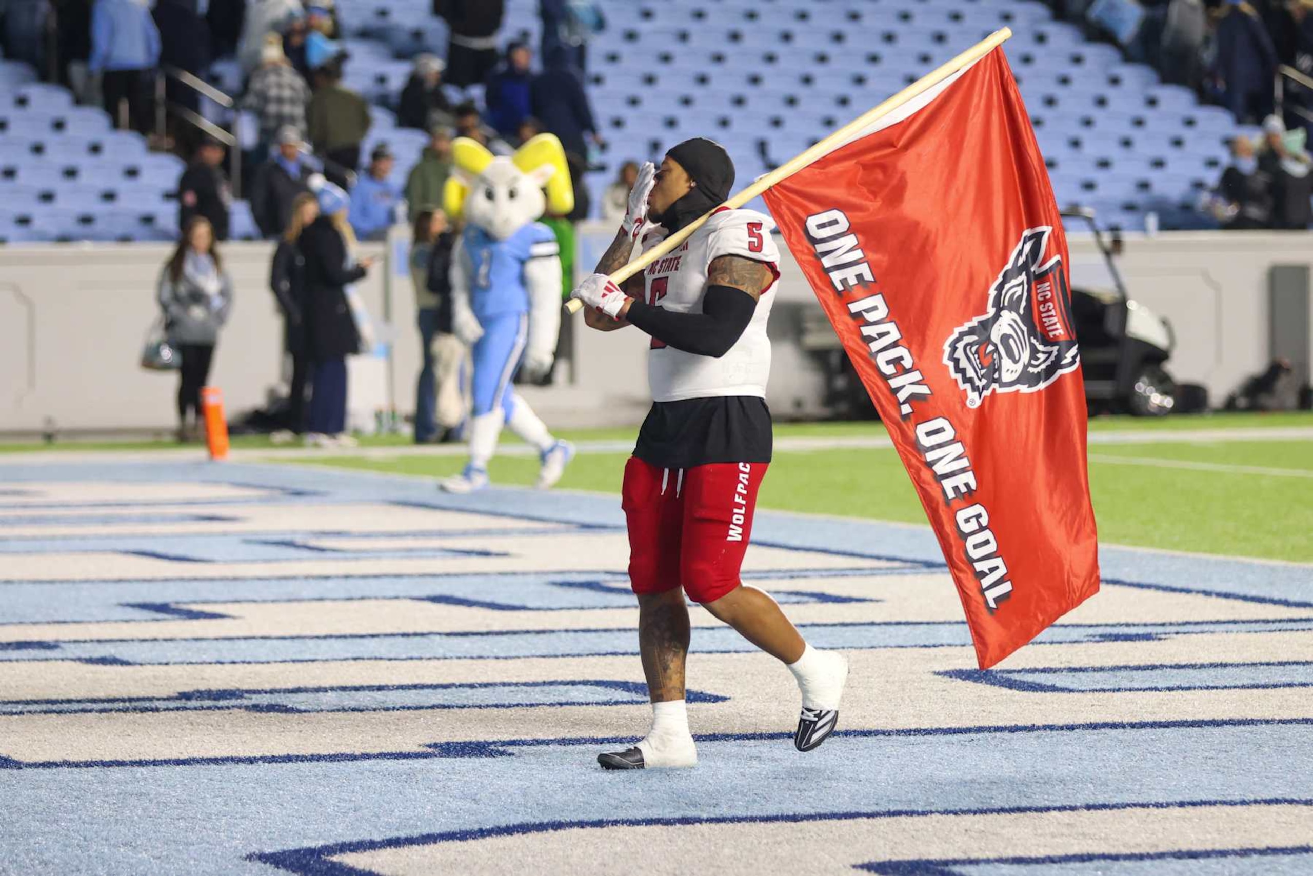 CHAPEL HILL, NC - NOVEMBER 30: North Carolina State Wolfpack safety DK Kaufman (5) blows a kiss to the remaining North Carolina Tar Heels fans after winning the college basketball game between the North Carolina Tar Heels and the North Carolina State Wolfpack on November 30, 2024 at Kenan Memorial Stadium in Chapel Hill, NC. (Photo by Nicholas Faulkner/Icon Sportswire via Getty Images)