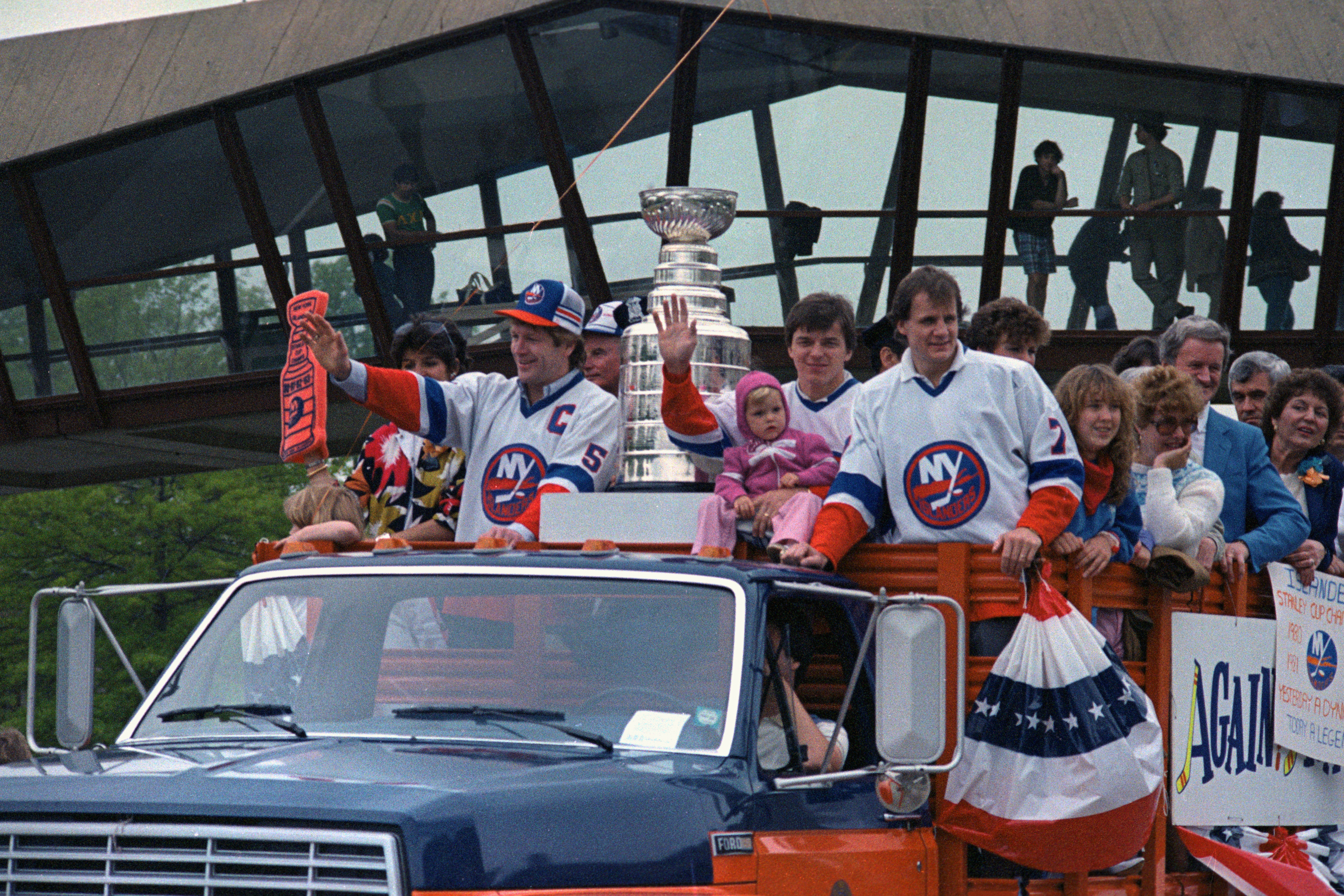 (Original Caption) Uniondale, New York: The Stanley Cup winning New York Islanders ride in the back of a truck in Uniondale, new York. In the truck are Denis Potvin, Anders Kailur and Stefan Persson, along with the Stanley Cup.