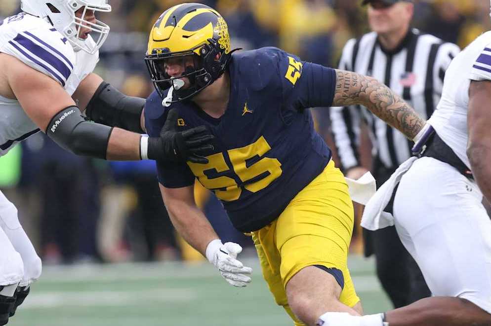ANN ARBOR, MI - NOVEMBER 23: Michigan Wolverines defensive lineman Mason Graham (55) rushes during a play during a regular season Big Ten Conference college football game between the Northwestern Wildcats and the Michigan Wolverines on November 23, 2024 at Michigan Stadium in Ann Arbor, Michigan. (Photo by Scott W. Grau/Icon Sportswire via Getty Images)