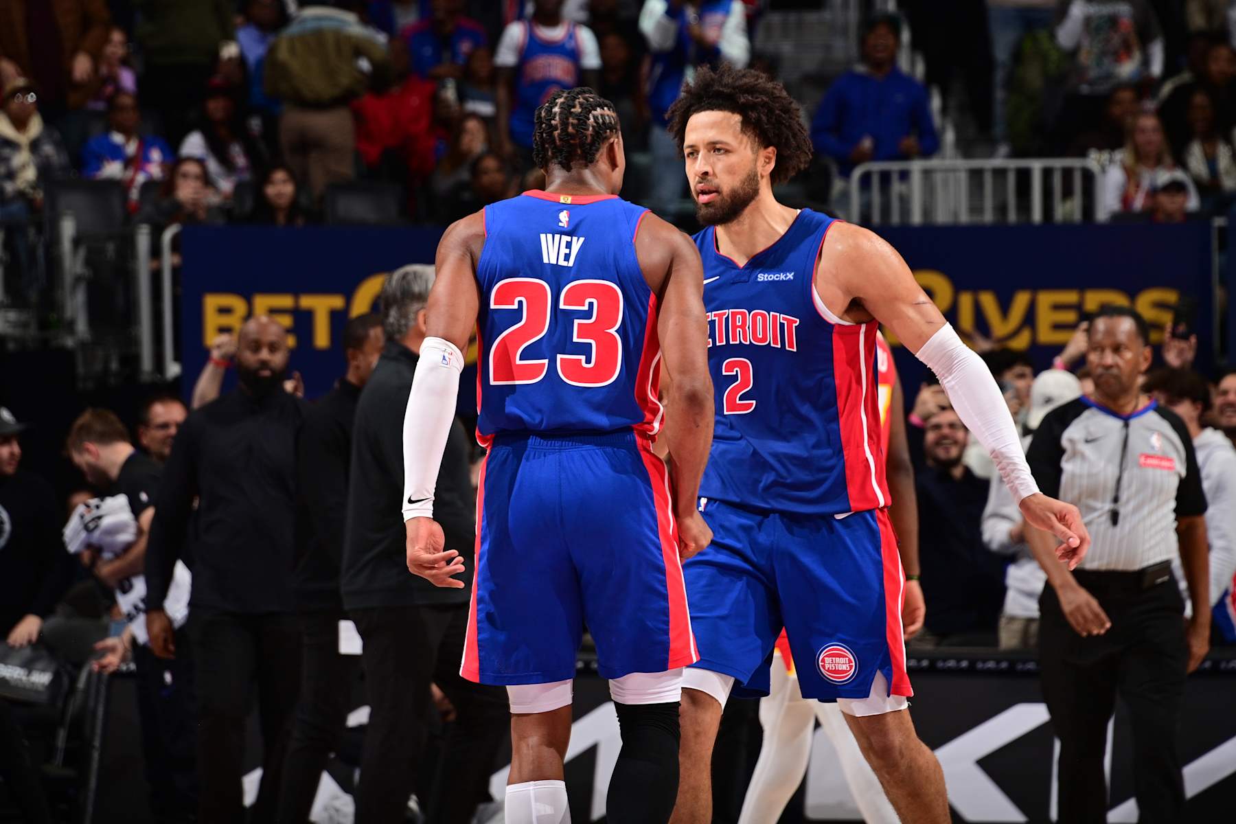 DETROIT, MI - NOVEMBER 8: Jaden Ivey #23 and Cade Cunningham #2 of the Detroit Pistons celebrate during the game against the Atlanta Hawks on November  8, 2024 at Little Caesars Arena in Detroit, Michigan. NOTE TO USER: User expressly acknowledges and agrees that, by downloading and/or using this photograph, User is consenting to the terms and conditions of the Getty Images License Agreement. Mandatory Copyright Notice: Copyright 2024 NBAE (Photo by Chris Schwegler/NBAE via Getty Images)