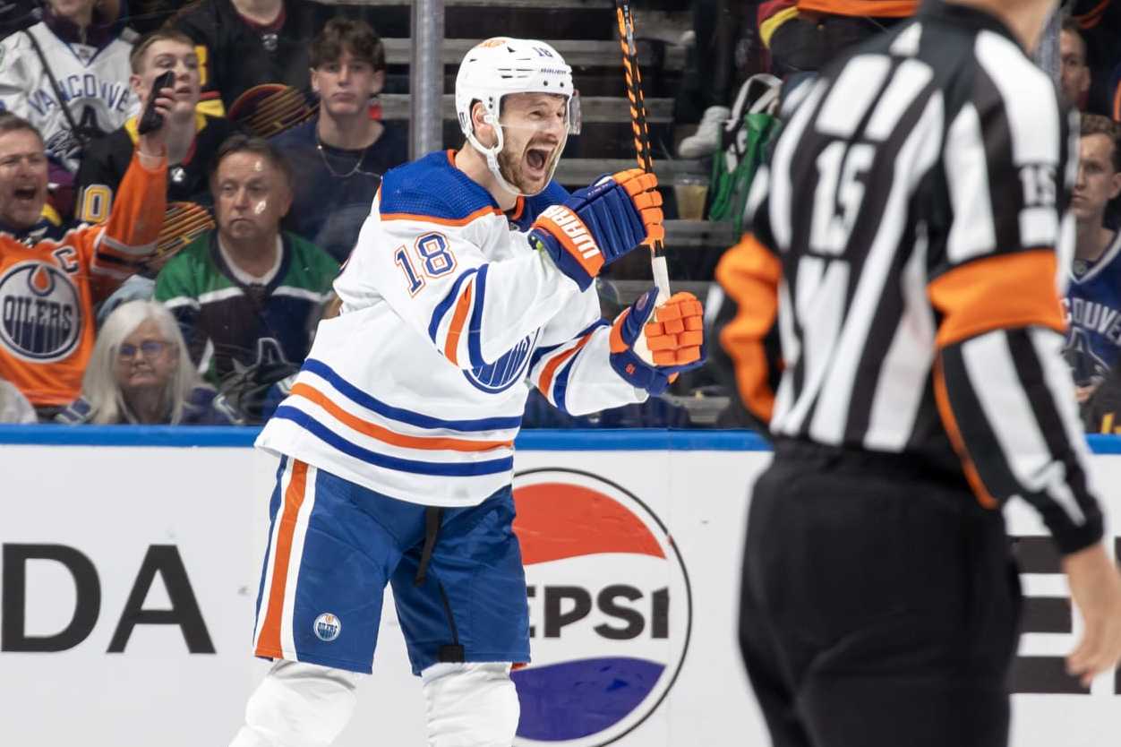 VANCOUVER, CANADA - MAY 20: Zach Hyman #18 celebrates Evan Bouchard #2 of the Edmonton Oilers goal during the second period in Game Seven of the Second Round of the 2024 Stanley Cup Playoffs against the Vancouver Canucks at Rogers Arena on May 20, 2024 in Vancouver, British Columbia, Canada.  (Photo by Jeff Vinnick/NHLI via Getty Images)