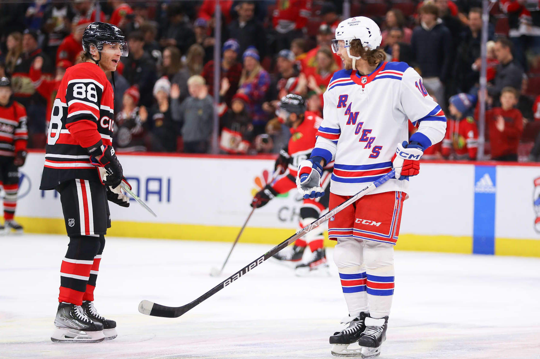CHICAGO, IL - DECEMBER 18: Chicago Blackhawks Right Wing Patrick Kane (88) and New York Rangers Left Wing Artemi Panarin (10) chat during warm-ups before a game between the New York Rangers and the Chicago Blackhawks on December 18, 2022 at the United Center in Chicago, IL. (Photo by Melissa Tamez/Icon Sportswire via Getty Images)