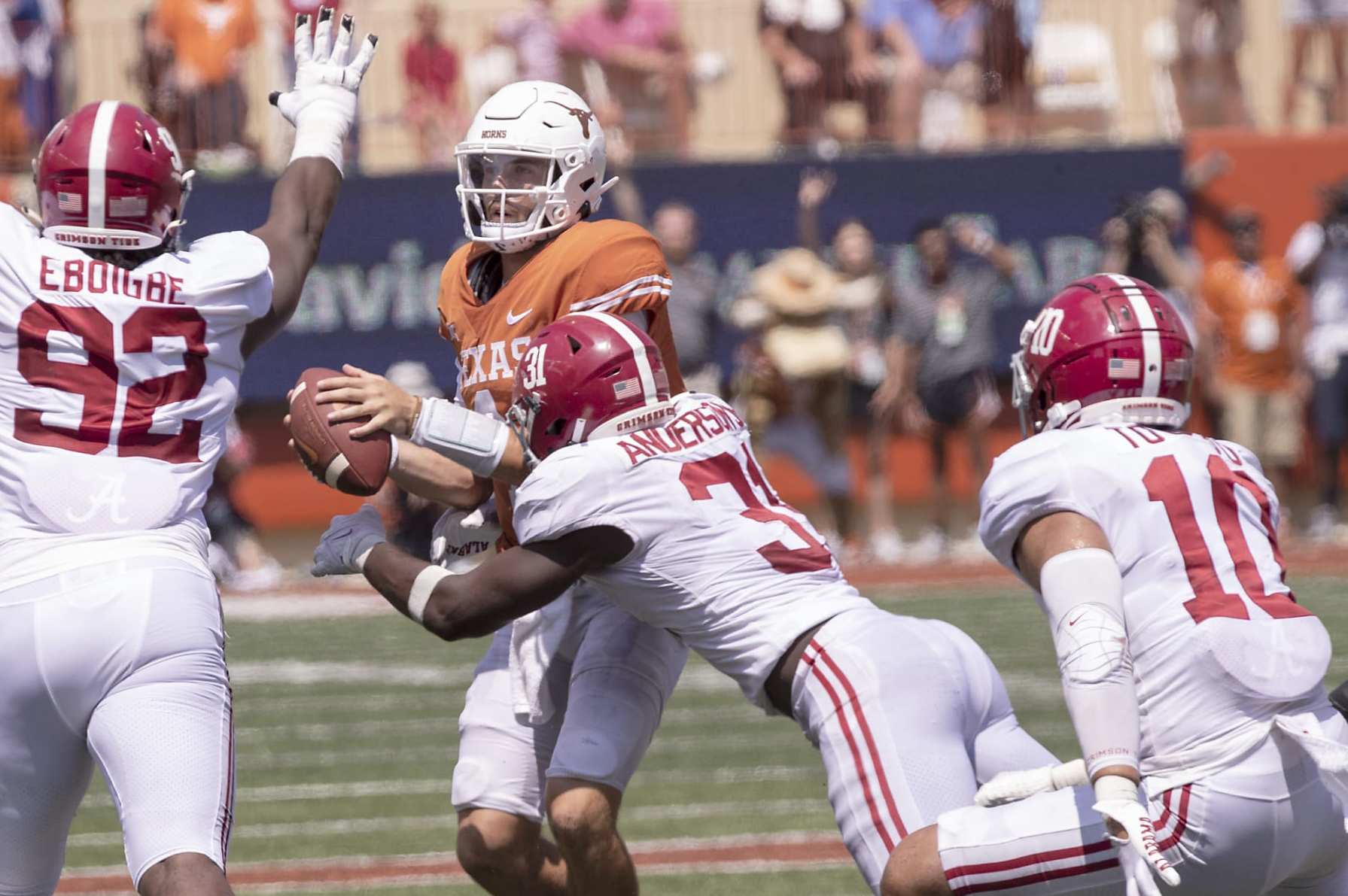 Texas quarterback Hudson Card (1) is sacked by Alabama linebacker Will Anderson Jr. (31) as Justin Eboigbe (92) and linebacker Henry To'oTo'o (10) help defend during the second half of an NCAA college football game, Saturday, Sept. 10, 2022, in Austin, Texas. Alabama defeated Texas 20-19. (AP Photo/Rodolfo Gonzalez) Texas quarterback Hudson Card (1) is sacked by Alabama linebacker Will Anderson Jr. (31) as Justin Eboigbe (92) and linebacker Henry To'oTo'o (10) help defend during the second half of an NCAA college football game, Saturday, Sept. 10, 2022, in Austin, Texas. Alabama defeated Texas 20-19. (AP Photo/Rodolfo Gonzalez)