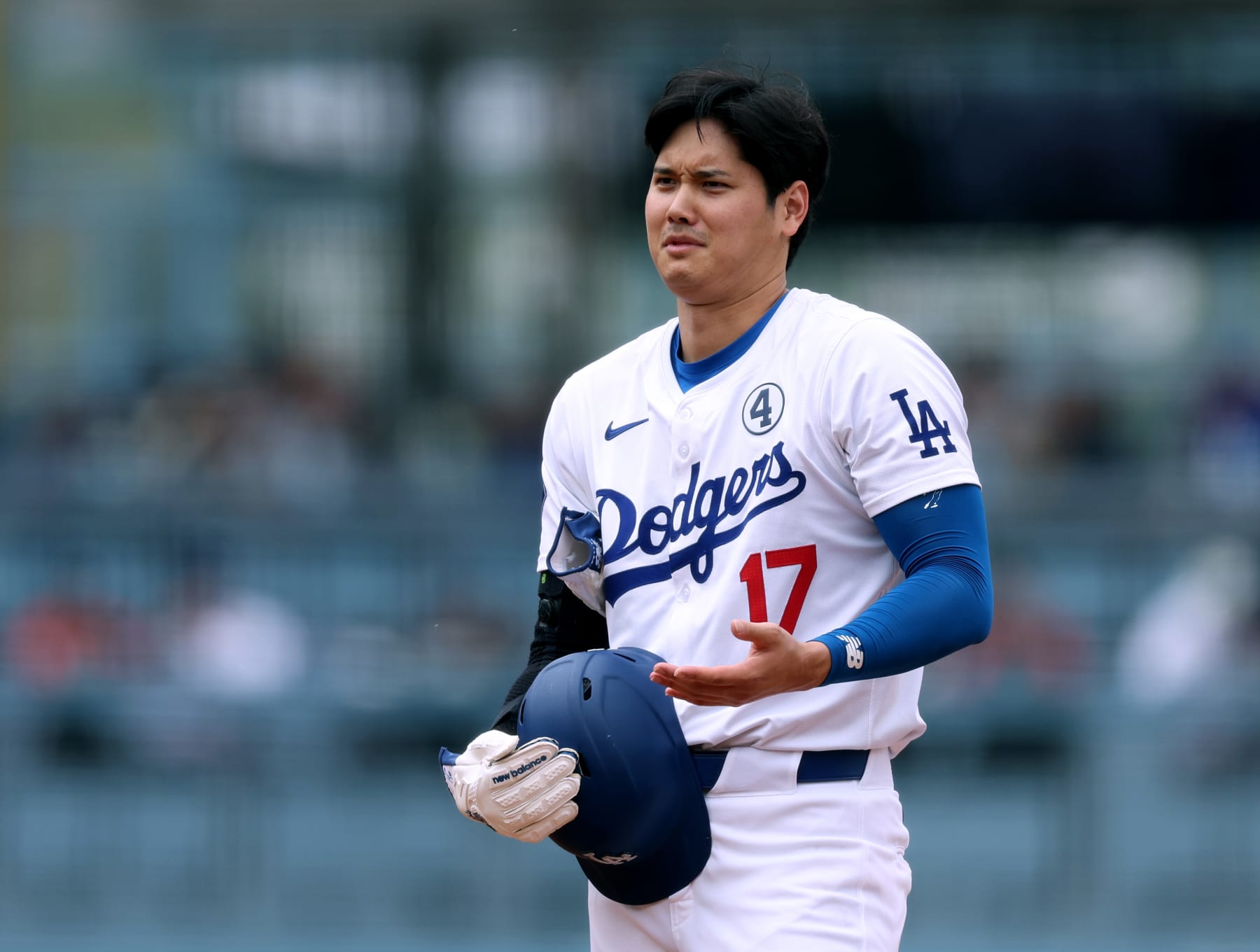 LOS ANGELES, CALIFORNIA - JUNE 02: Shohei Ohtani #17 of the Los Angeles Dodgers smiles at second base, advancing on a wild pitch, during the sixth inning against the Colorado Rockies at Dodger Stadium on June 02, 2024 in Los Angeles, California. (Photo by Harry How/Getty Images)