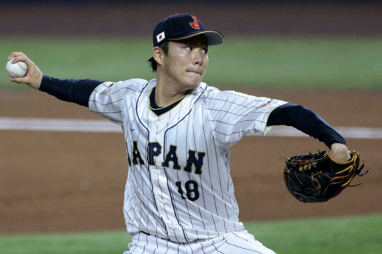 MIAMI, FL - MARCH 20: Yoshinobu Yamamoto #18 of Team Japan pitches during the 2023 World Baseball Classic Semifinal game against Team Mexico at loanDepot Park on Monday, March 20, 2023 in Miami, Florida. (Photo by Christopher Pasatieri/Getty Images)