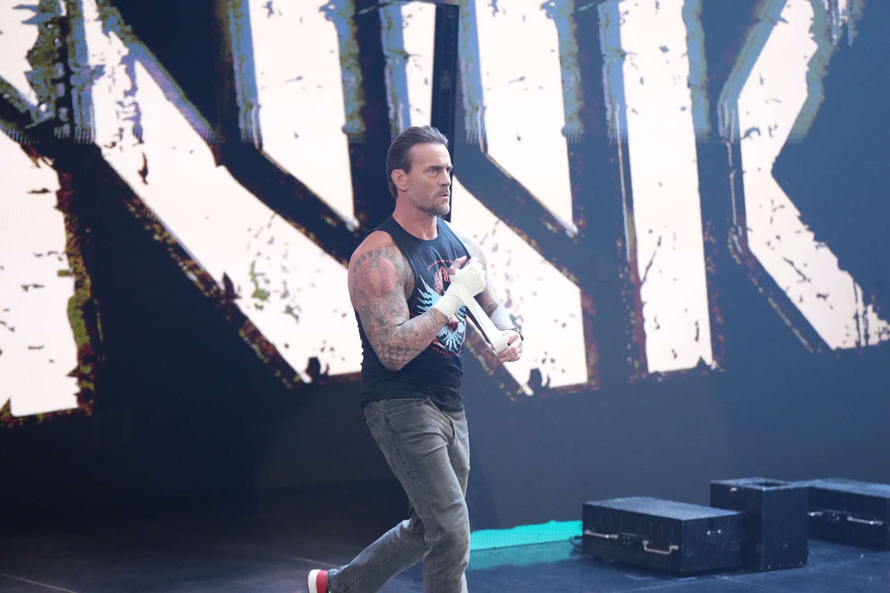 SALT LAKE CITY, UTAH - NOVEMBER 22: CM Punk entrance during WWE SmackDown at Delta Center on November 22, 2024 in Salt Lake City, Utah.  (Photo by WWE/Getty Images)