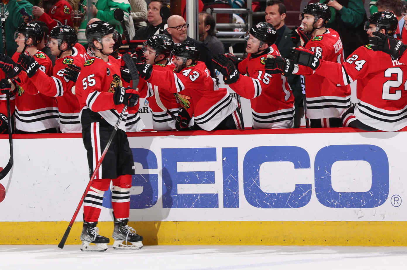CHICAGO, ILLINOIS - MARCH 17: Kevin Korchinski #55 of the Chicago Blackhawks reacts at the bench after scoring against the San Jose Sharks in the third period at the United Center on March 17, 2024 in Chicago, Illinois. (Photo by Chase Agnello-Dean/NHLI via Getty Images)