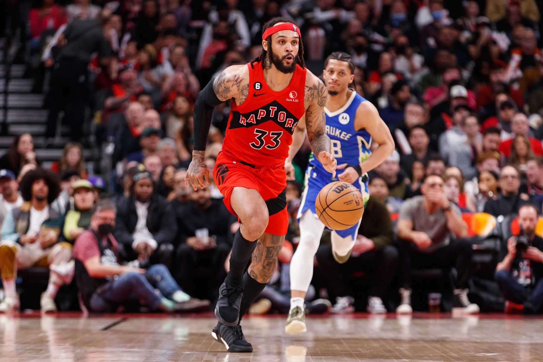 TORONTO, ON - APRIL 09: Gary Trent Jr. #33 of the Toronto Raptors dribbles up the court against the Milwaukee Bucks during the first half of their NBA game at Scotiabank Arena on April 9, 2023 in Toronto, Canada. NOTE TO USER: User expressly acknowledges and agrees that, by downloading and or using this photograph, User is consenting to the terms and conditions of the Getty Images License Agreement. (Photo by Cole Burston/Getty Images)
