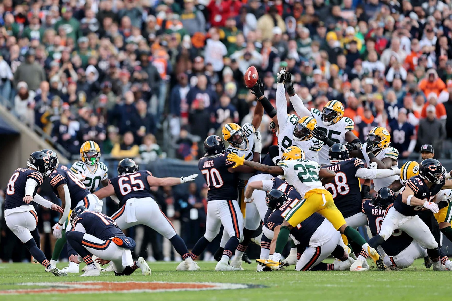 CHICAGO, ILLINOIS - NOVEMBER 17: Cairo Santos #8 of the Chicago Bears watches as Karl Brooks #94 of the Green Bay Packers blocks a potential game winning field goal at the end of the fourth quarter of a game at Soldier Field on November 17, 2024 in Chicago, Illinois. (Photo by Michael Reaves/Getty Images)