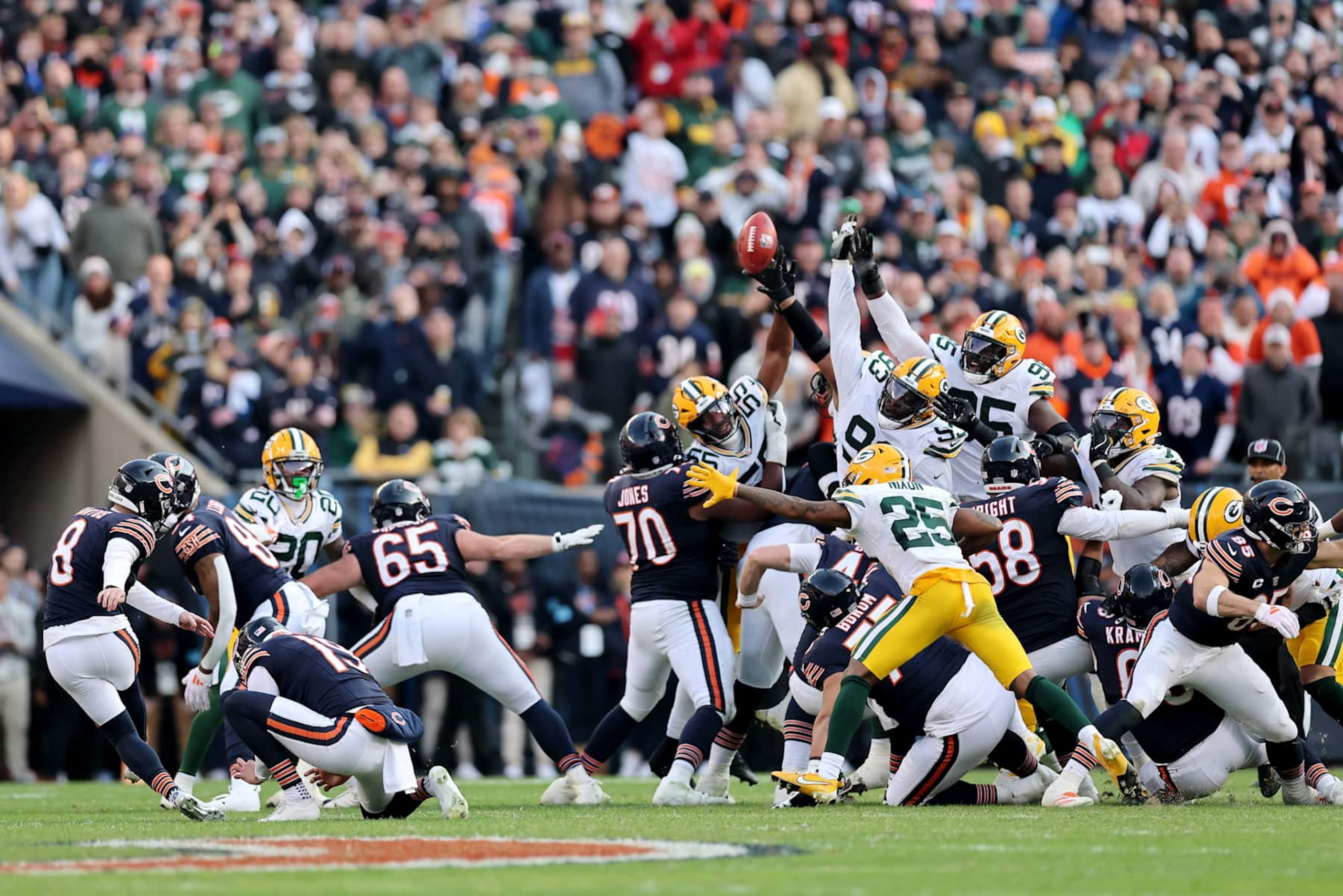 CHICAGO, ILLINOIS - NOVEMBER 17: Cairo Santos #8 of the Chicago Bears watches as Karl Brooks #94 of the Green Bay Packers blocks a potential game winning field goal at the end of the fourth quarter of a game at Soldier Field on November 17, 2024 in Chicago, Illinois. (Photo by Michael Reaves/Getty Images)