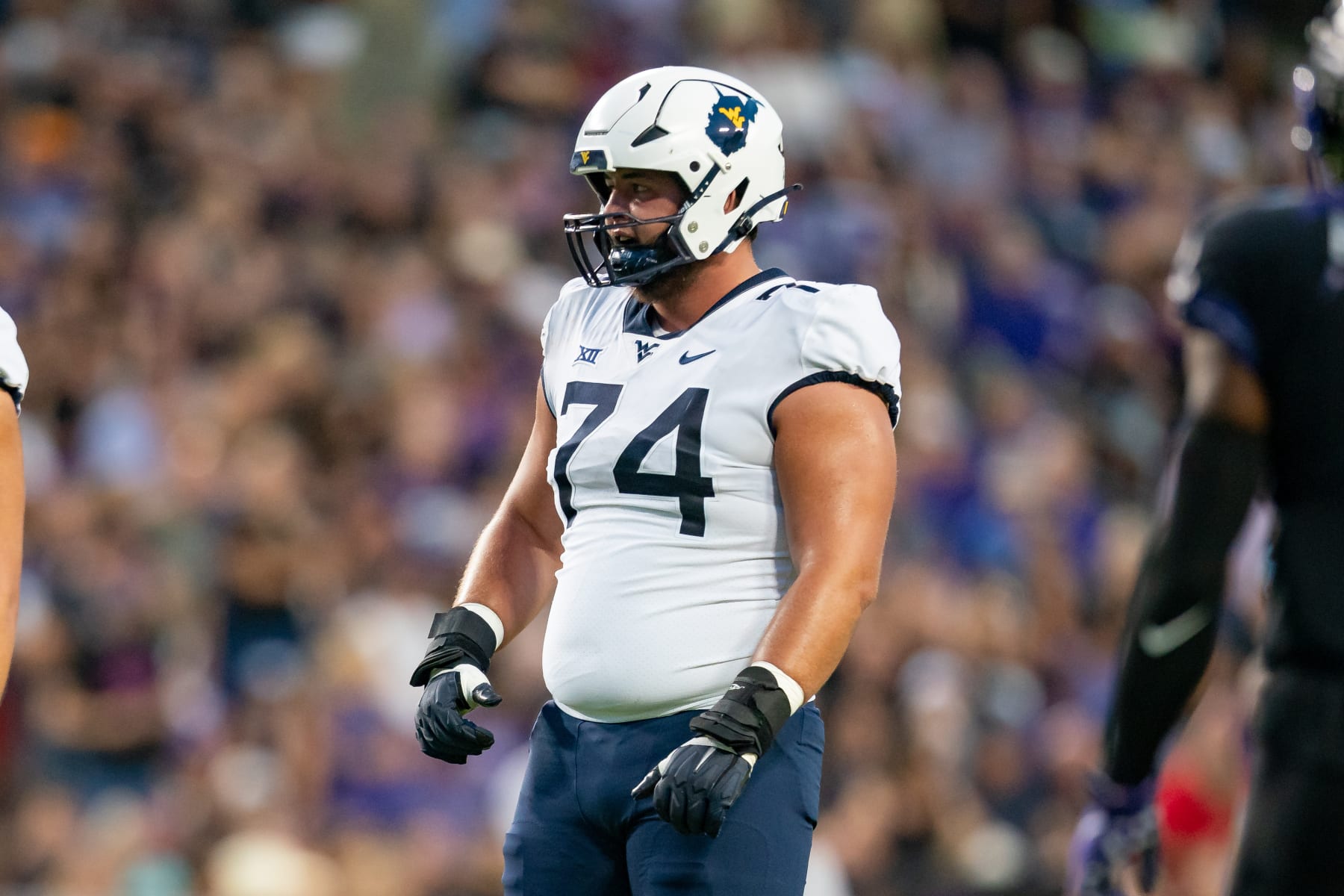 FORT WORTH, TX - SEPTEMBER 30: West Virginia Mountaineers offensive lineman Wyatt Milum (74) looks to the defense between plays during a college football game between West Virginia Mountaineers and TCU Horned Frogs on Sept 30, 2023, at Amon G Cater Stadium in Fort Worth, TX.(Photo by Christopher Leduc/Icon Sportswire via Getty Images)