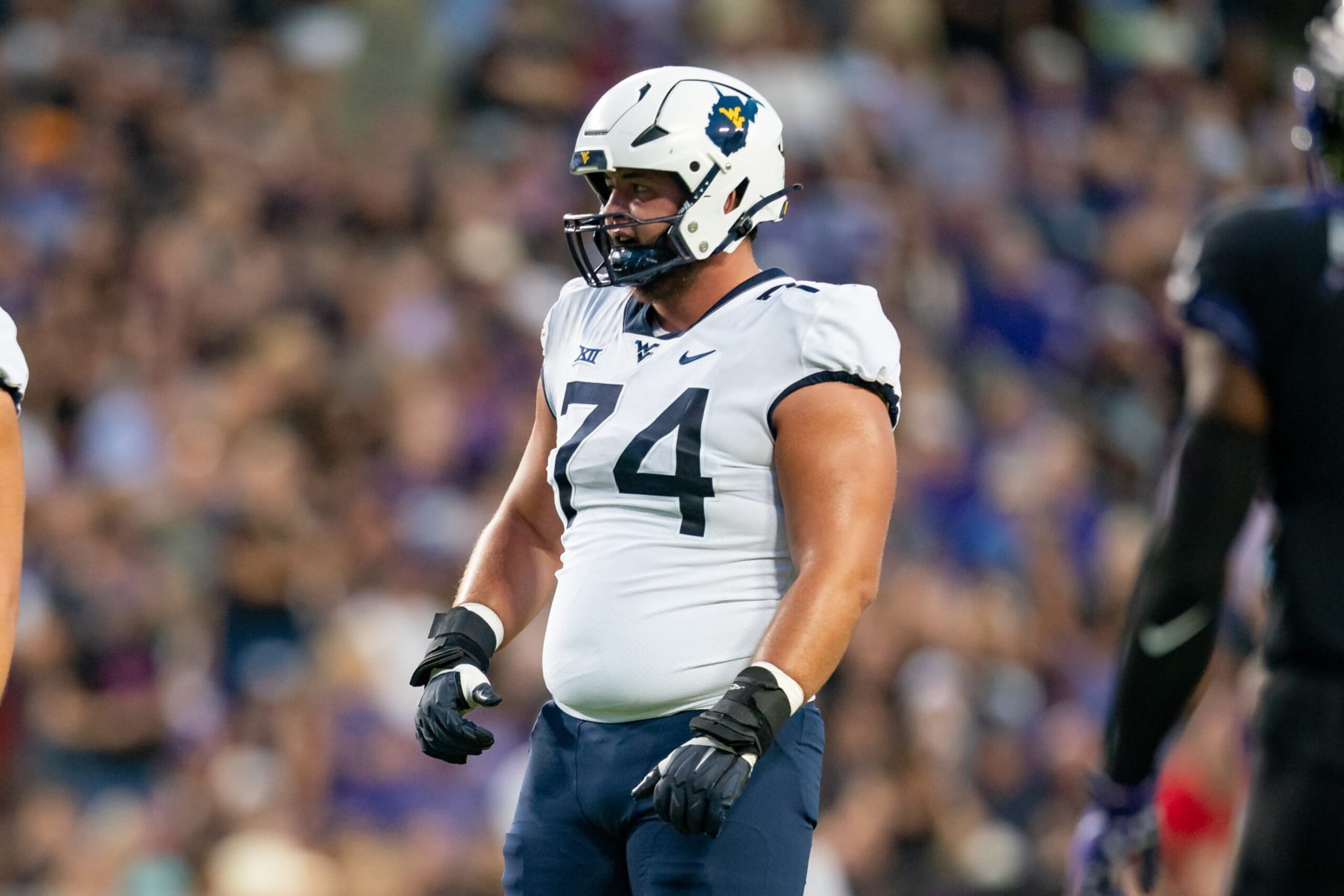 FORT WORTH, TX - SEPTEMBER 30: West Virginia Mountaineers offensive lineman Wyatt Milum (74) looks to the defense between plays during a college football game between West Virginia Mountaineers and TCU Horned Frogs on Sept 30, 2023, at Amon G Cater Stadium in Fort Worth, TX.(Photo by Christopher Leduc/Icon Sportswire via Getty Images) FORT WORTH, TX - SEPTEMBER 30: West Virginia Mountaineers offensive lineman Wyatt Milum (74) looks to the defense between plays during a college football game between West Virginia Mountaineers and TCU Horned Frogs on Sept 30, 2023, at Amon G Cater Stadium in Fort Worth, TX.(Photo by Christopher Leduc/Icon Sportswire via Getty Images)