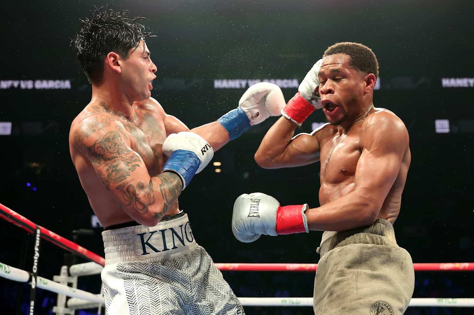 NEW YORK, NEW YORK - APRIL 20: Ryan Garcia (white trunks) punches Devin Haney (gray trunks) during their WBC Super Lightweight title bout at Barclays Center on April 20, 2024 in New York City. (Photo by Al Bello/Getty Images)