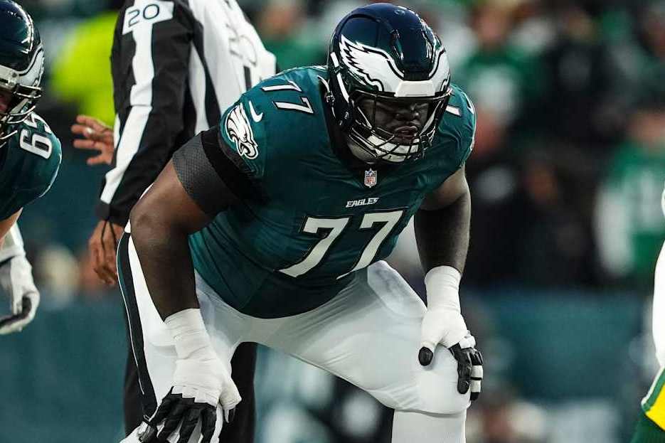 PHILADELPHIA, PA - JANUARY 12: Mekhi Becton #77 of the Philadelphia Eagles lines up before the snap during an NFL football wild card playoff game against the Green Bay Packers at Lincoln Financial Field on January 12, 2025 in Philadelphia, Pennsylvania. (Photo by Cooper Neill/Getty Images)