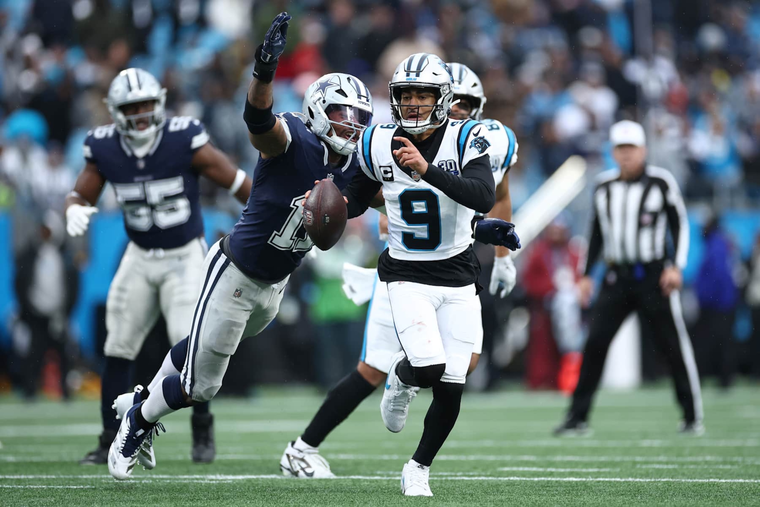 Dallas Cowboys defender Micah Parsons nears a sack of Carolina Panthers quarterback Bryce Young. 