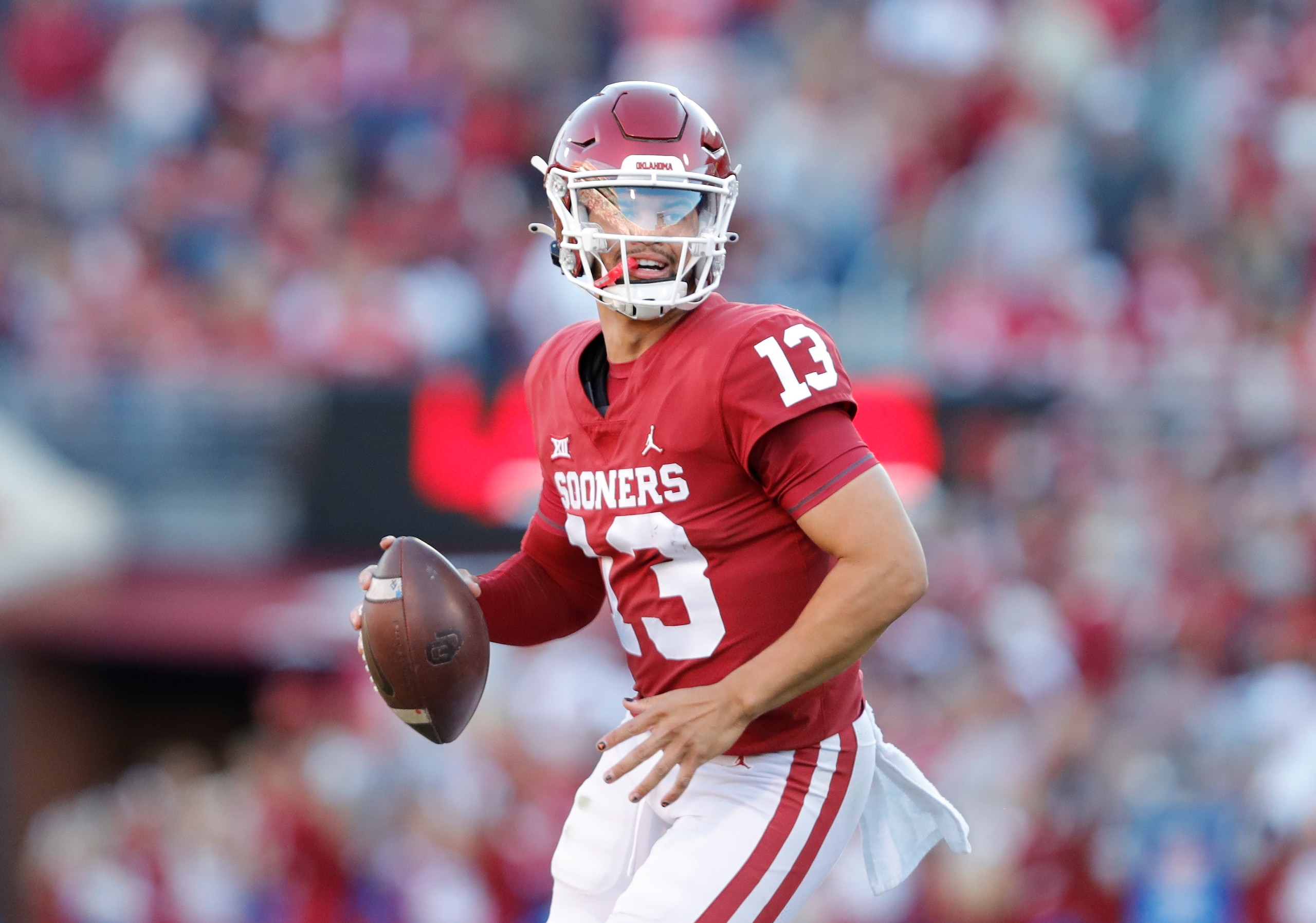 Oklahoma quarterback Caleb Williams (13) passes during the second half of an NCAA college football game against Texas Tech, Saturday, Oct. 30, 2021, in Norman, Okla. Oklahoma won 52-21. (AP Photo/Alonzo Adams)