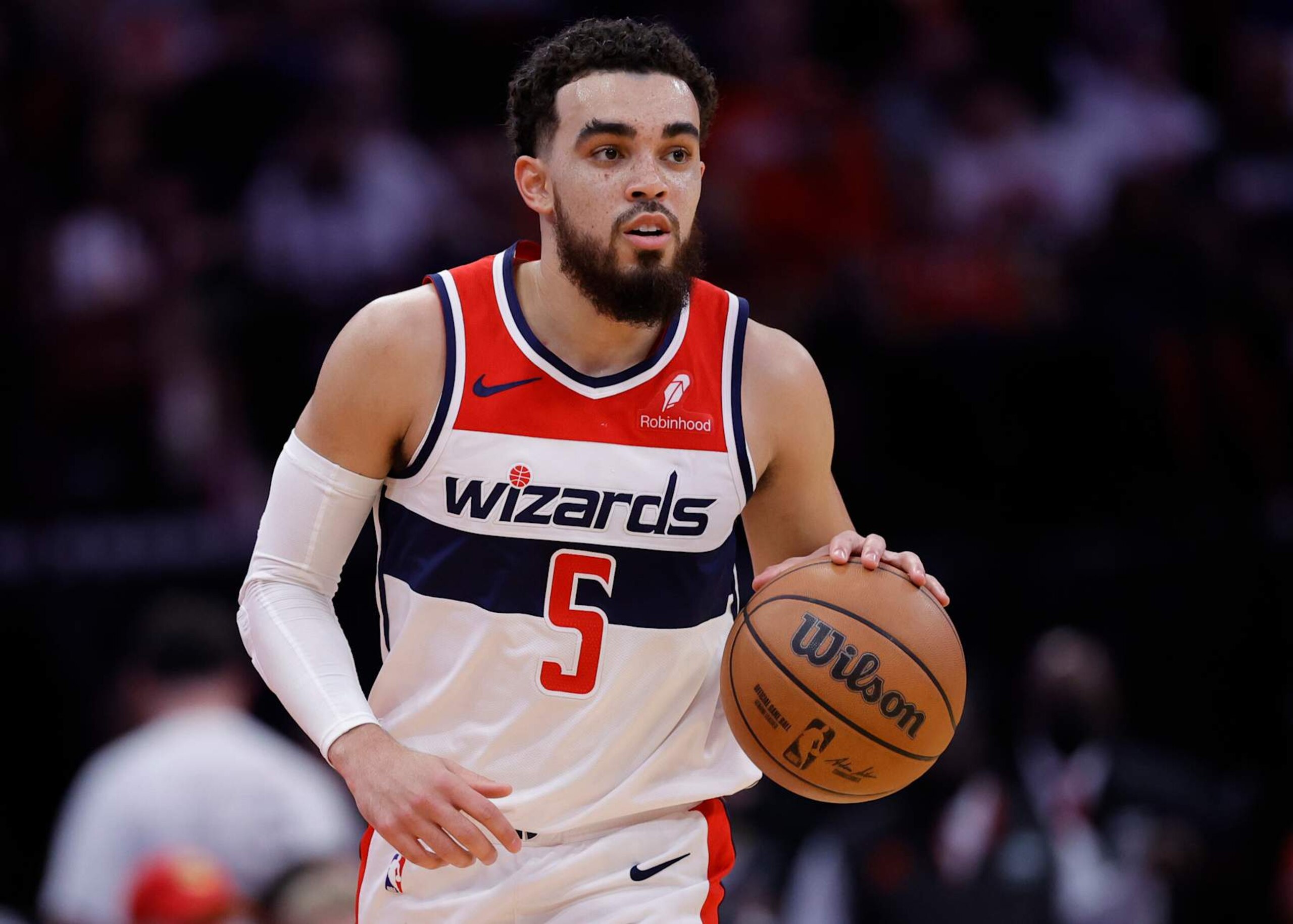 HOUSTON, TEXAS - MARCH 14: Tyus Jones #5 of the Washington Wizards in action against the Houston Rockets during the first half at Toyota Center on March 14, 2024 in Houston, Texas. NOTE TO USER: User expressly acknowledges and agrees that, by downloading and or using this photograph, User is consenting to the terms and conditions of the Getty Images License Agreement.  (Photo by Carmen Mandato/Getty Images)
