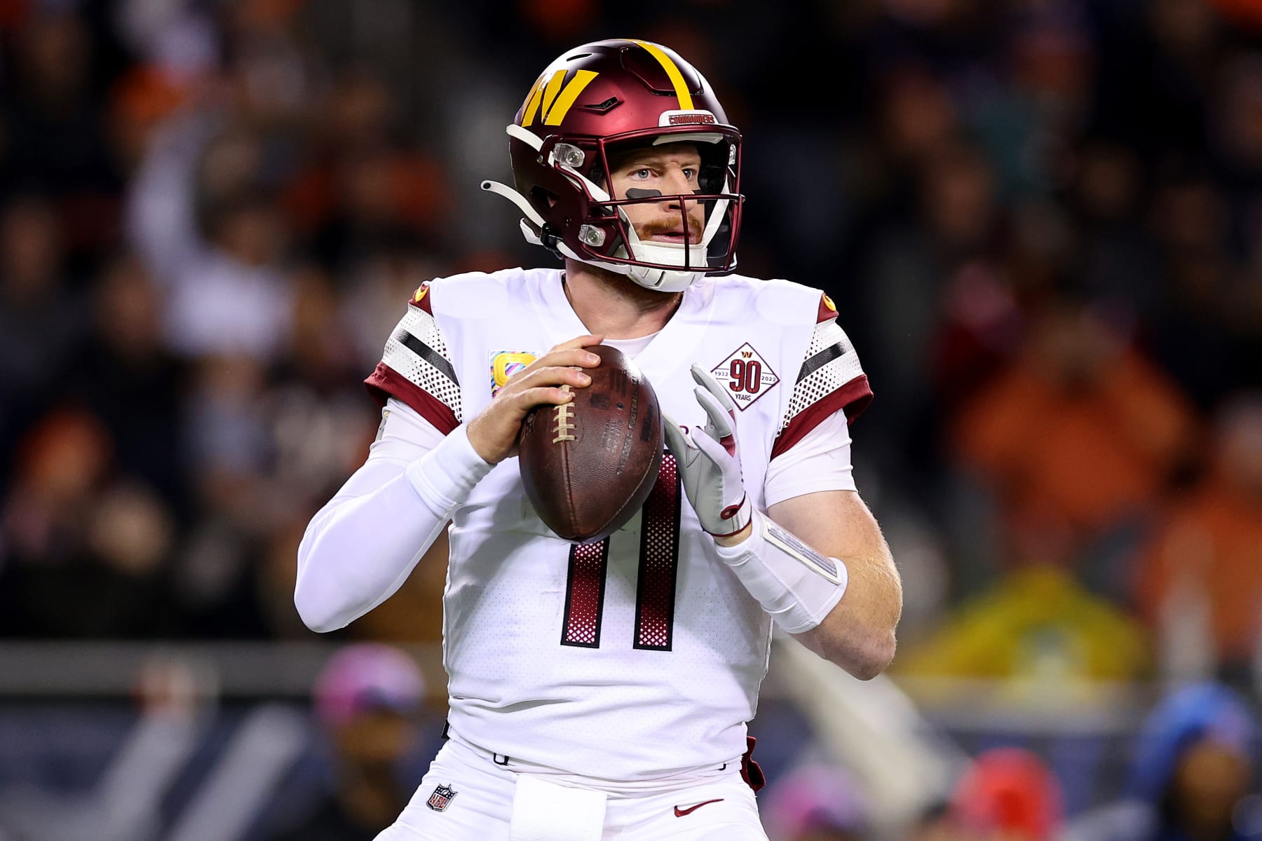CHICAGO, ILLINOIS - OCTOBER 13: Carson Wentz #11 of the Washington Commanders looks to pass during the second quarter against the Chicago Bears at Soldier Field on October 13, 2022 in Chicago, Illinois. (Photo by Michael Reaves/Getty Images)
