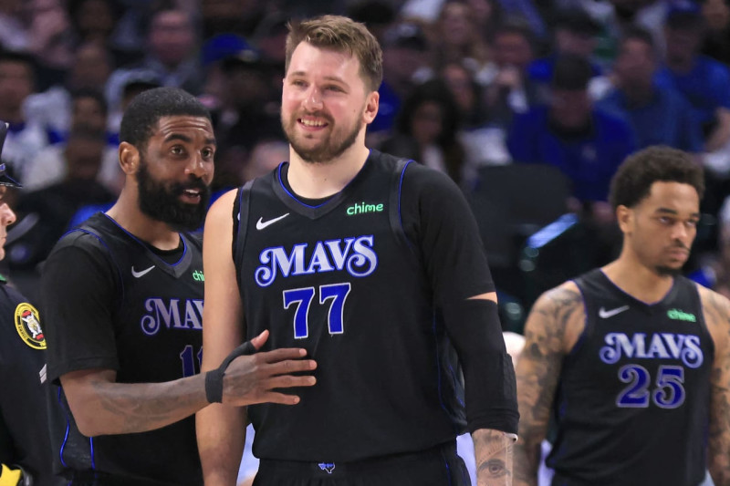 DALLAS, TX - FEBRUARY 22: Kyrie Irving #11 of the Dallas Mavericks and teammate Luka Doncic #77 react after a basket against the Phoenix Suns in the second half at American Airlines Center on February 22, 2024 in Dallas, Texas. NOTE TO USER: User expressly acknowledges and agrees that, by downloading and or using this photograph, User is consenting to the terms and conditions of the Getty Images License Agreement. (Photo by Ron Jenkins/Getty Images)