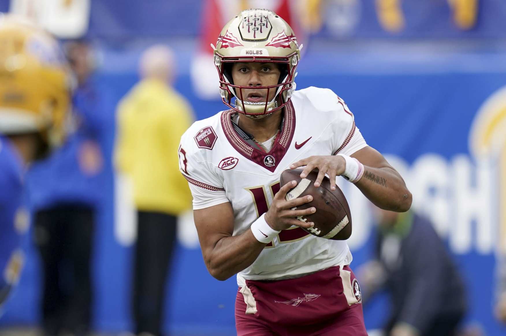 Florida State quarterback Jordan Travis (13) looks to throw a pass during the first half of an NCAA college football game against Pittsburgh in Pittsburgh, Saturday, Nov. 4, 2023. (AP Photo/Matt Freed)