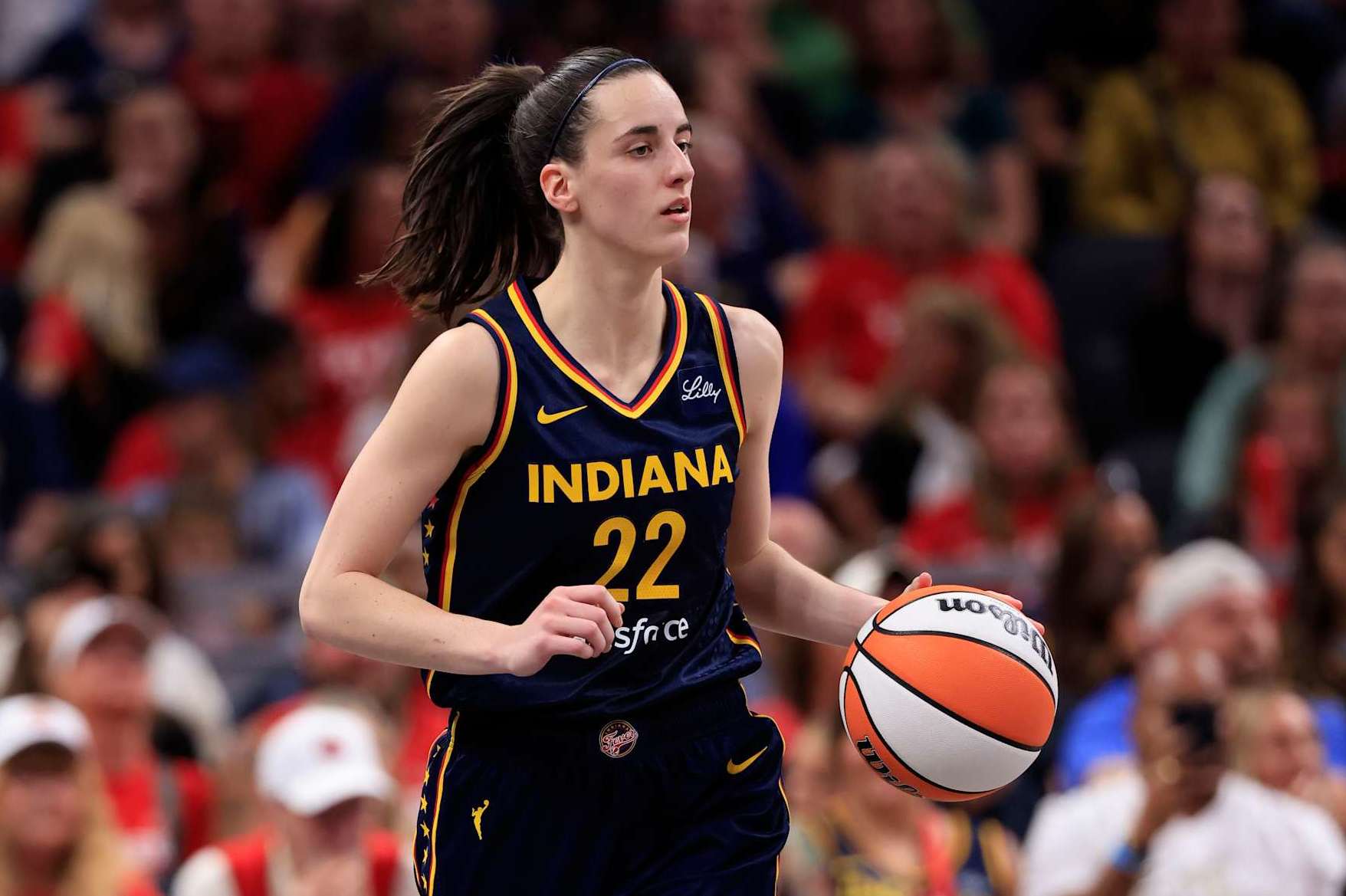 INDIANAPOLIS, INDIANA - SEPTEMBER 15: Caitlin Clark #22 of the Indiana Fever brings the ball up the court against the Dallas Wings at Gainbridge Fieldhouse on September 15, 2024 in Indianapolis, Indiana. NOTE TO USER: User expressly acknowledges and agrees that, by downloading and or using this photograph, User is consenting to the terms and conditions of the Getty Images License Agreement. (Photo by Justin Casterline/Getty Images)