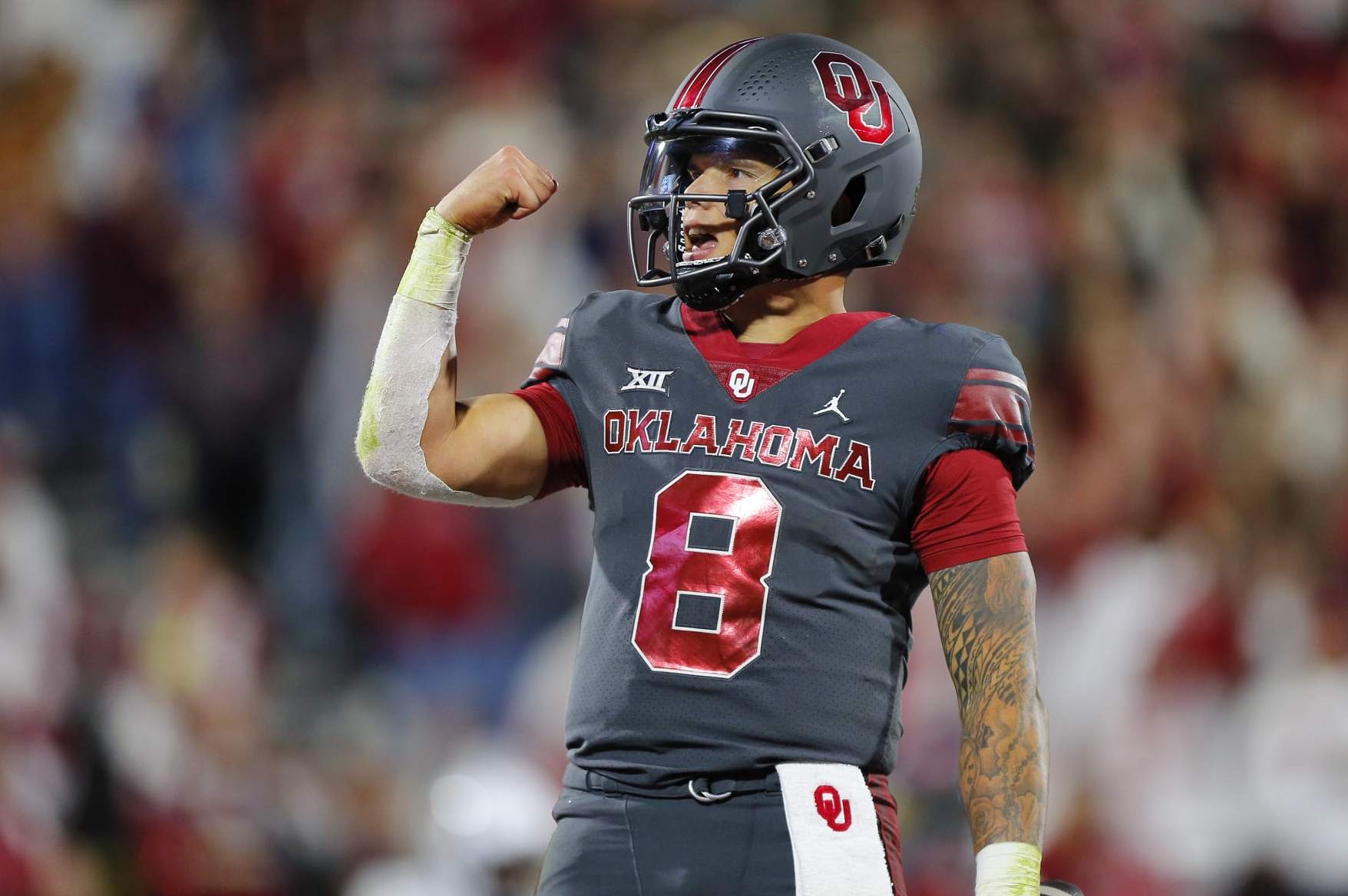 NORMAN, OKLAHOMA - NOVEMBER 11: Quarterback Dillon Gabriel #8 of the Oklahoma Sooners pumps his fist after running for a five-yard touchdown against the West Virginia Mountaineers in the fourth quarter at Gaylord Family Oklahoma Memorial Stadium on November 11, 2023 in Norman, Oklahoma. Dillon ran for three touchdowns and threw for two more. Oklahoma won 59-20. (Photo by Brian Bahr/Getty Images)