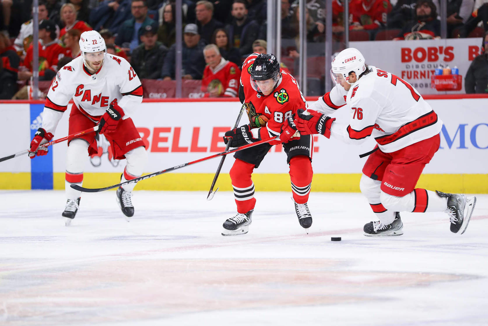CHICAGO, IL - NOVEMBER 14: Chicago Blackhawks right wing Patrick Kane (88) and Carolina Hurricanes defenseman Brady Skjei (76) battle for position during a game between the Carolina Hurricanes and the Chicago Blackhawks on November 14, 2022 at the United Center in Chicago, IL. (Photo by Melissa Tamez/Icon Sportswire via Getty Images)