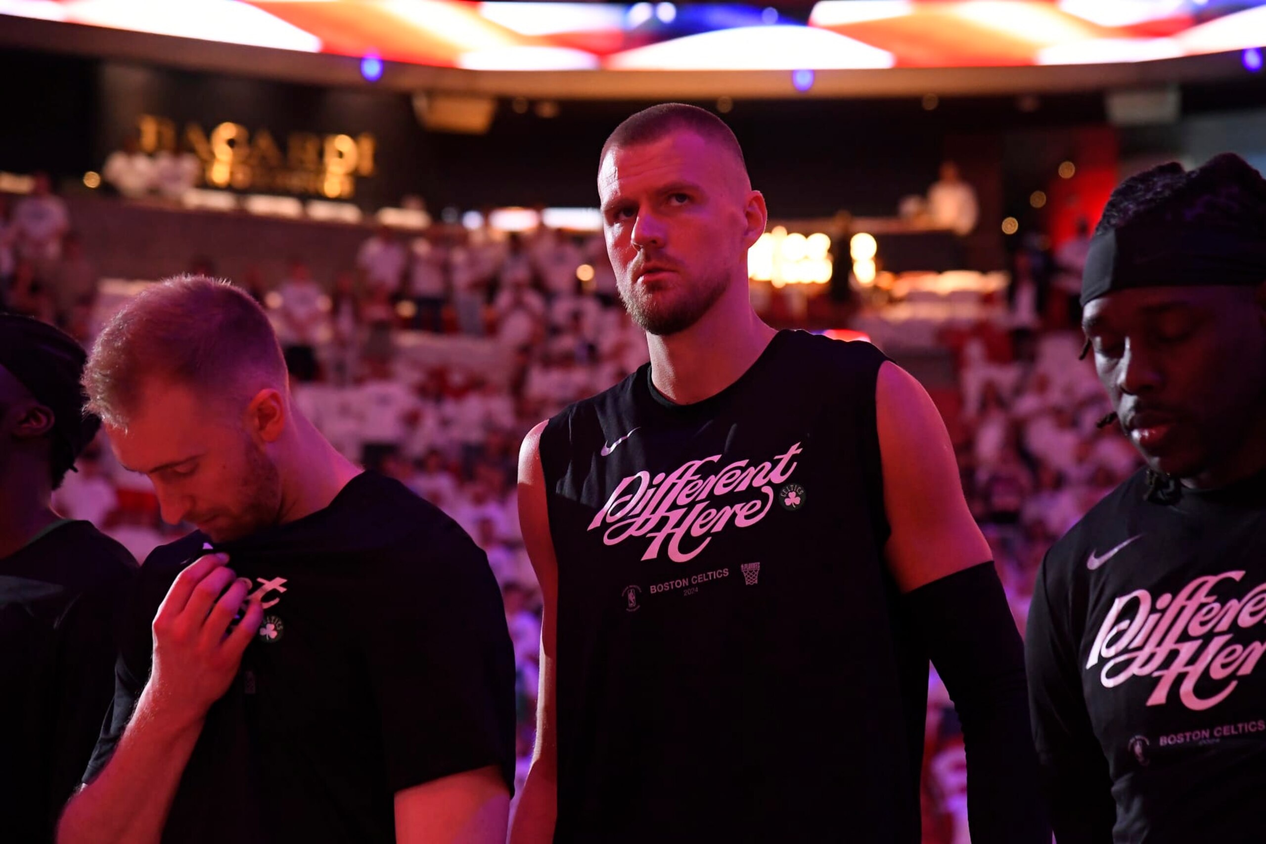 MIAMI, FL - APRIL 27: Kristaps Porzingis #8 of the Boston Celtics stands for the National Anthem before the game  against the Miami Heat  during Round 1 Game 3 of the 2024 NBA Playoffs on April 27, 2024 at Kaseya Center in Miami, Florida. NOTE TO USER: User expressly acknowledges and agrees that, by downloading and or using this Photograph, user is consenting to the terms and conditions of the Getty Images License Agreement. Mandatory Copyright Notice: Copyright 2024 NBAE (Photo by Brian Babineau/NBAE via Getty Images)