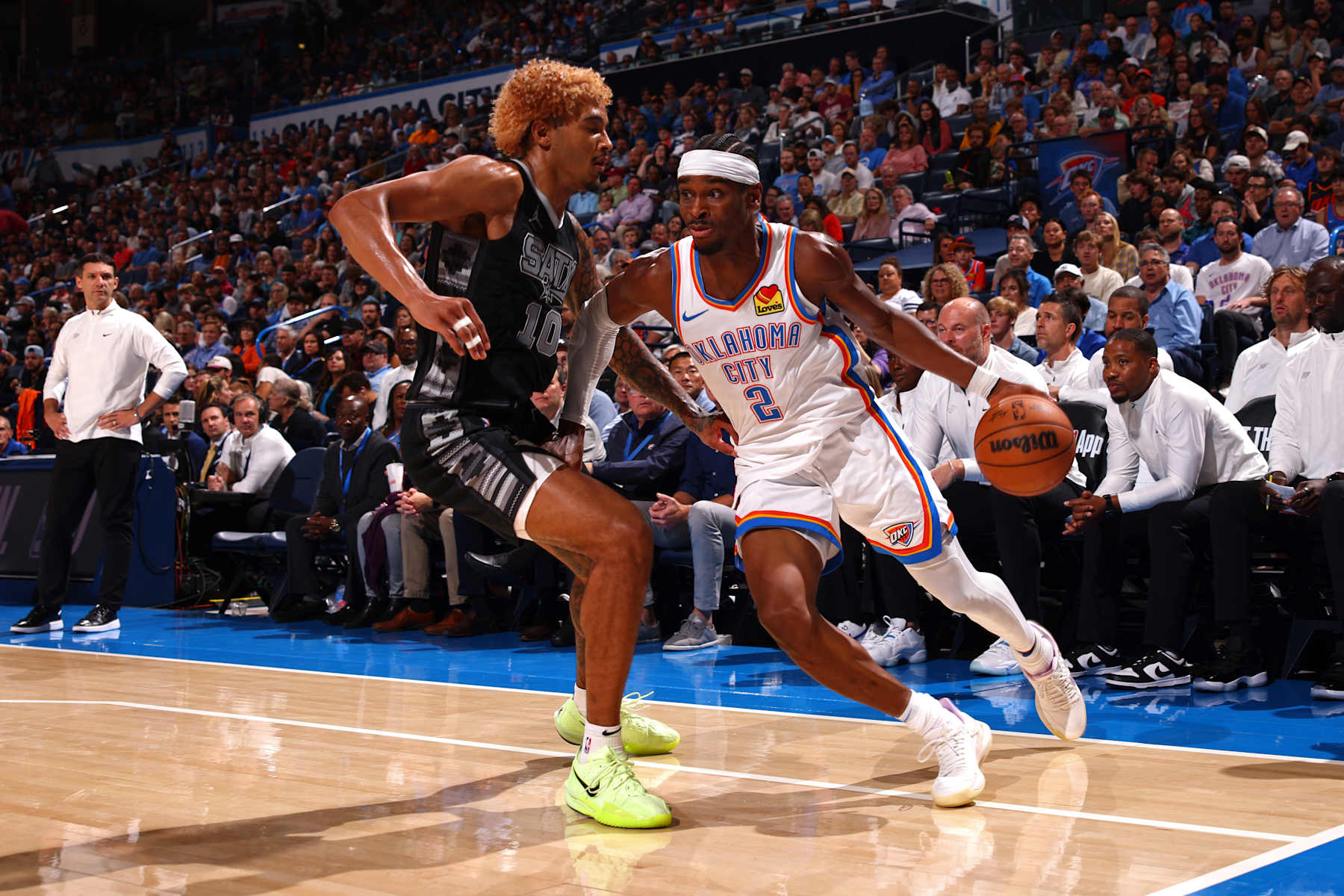 OKLAHOMA CITY, OK - OCTOBER 30: Shai Gilgeous-Alexander #2 of the Oklahoma City Thunder handles the ball during the game against the San Antonio Spurs on October 30, 2024 at Paycom Arena in Oklahoma City, Oklahoma. NOTE TO USER: User expressly acknowledges and agrees that, by downloading and or using this photograph, User is consenting to the terms and conditions of the Getty Images License Agreement. Mandatory Copyright Notice: Copyright 2024 NBAE (Photo by Zach Beeker/NBAE via Getty Images)