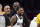 LOS ANGELES, CA - MARCH 17: Kyrie Irving #2 of the Dallas Mavericks greets LeBron James #6 of the Los Angeles Lakers during a timeout in the second half at Crypto.com Arena on March 17, 2023 in Los Angeles, California. NOTE TO USER: User expressly acknowledges and agrees that, by downloading and or using this photograph, User is consenting to the terms and conditions of the Getty Images License Agreement.(Photo by Kevork Djansezian/Getty Images)