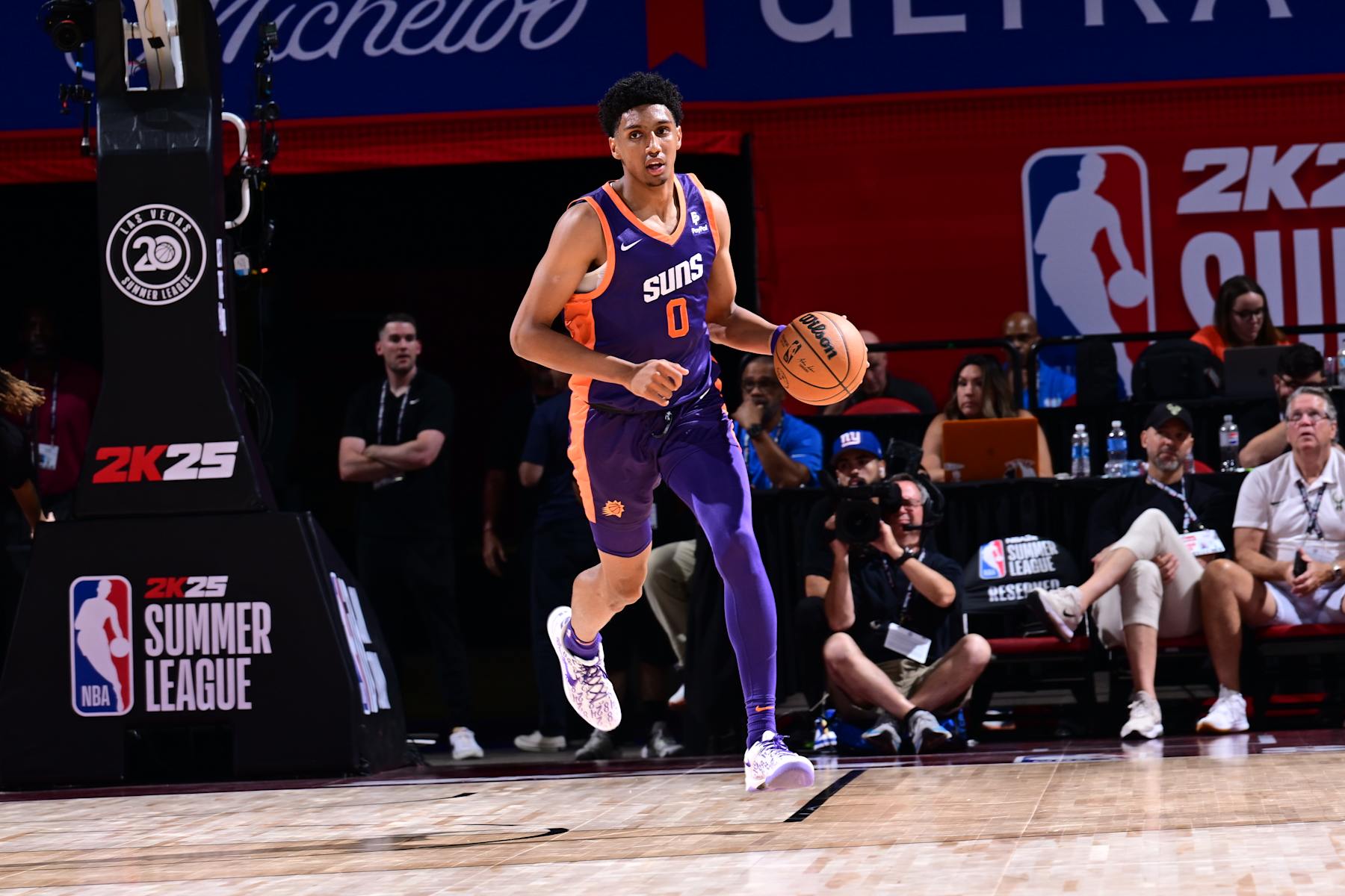 LAS VEGAS, NV - JULY 13: Ryan Dunn #0 of the Phoenix Suns dribbles the ball during the game against the Golden State Warriors on July 13, 2024 at the Thomas & Mack Center in Las Vegas, Nevada. NOTE TO USER: User expressly acknowledges and agrees that, by downloading and or using this photograph, User is consenting to the terms and conditions of the Getty Images License Agreement. Mandatory Copyright Notice: Copyright 2024 NBAE (Photo by Adam Hagy/NBAE via Getty Images)