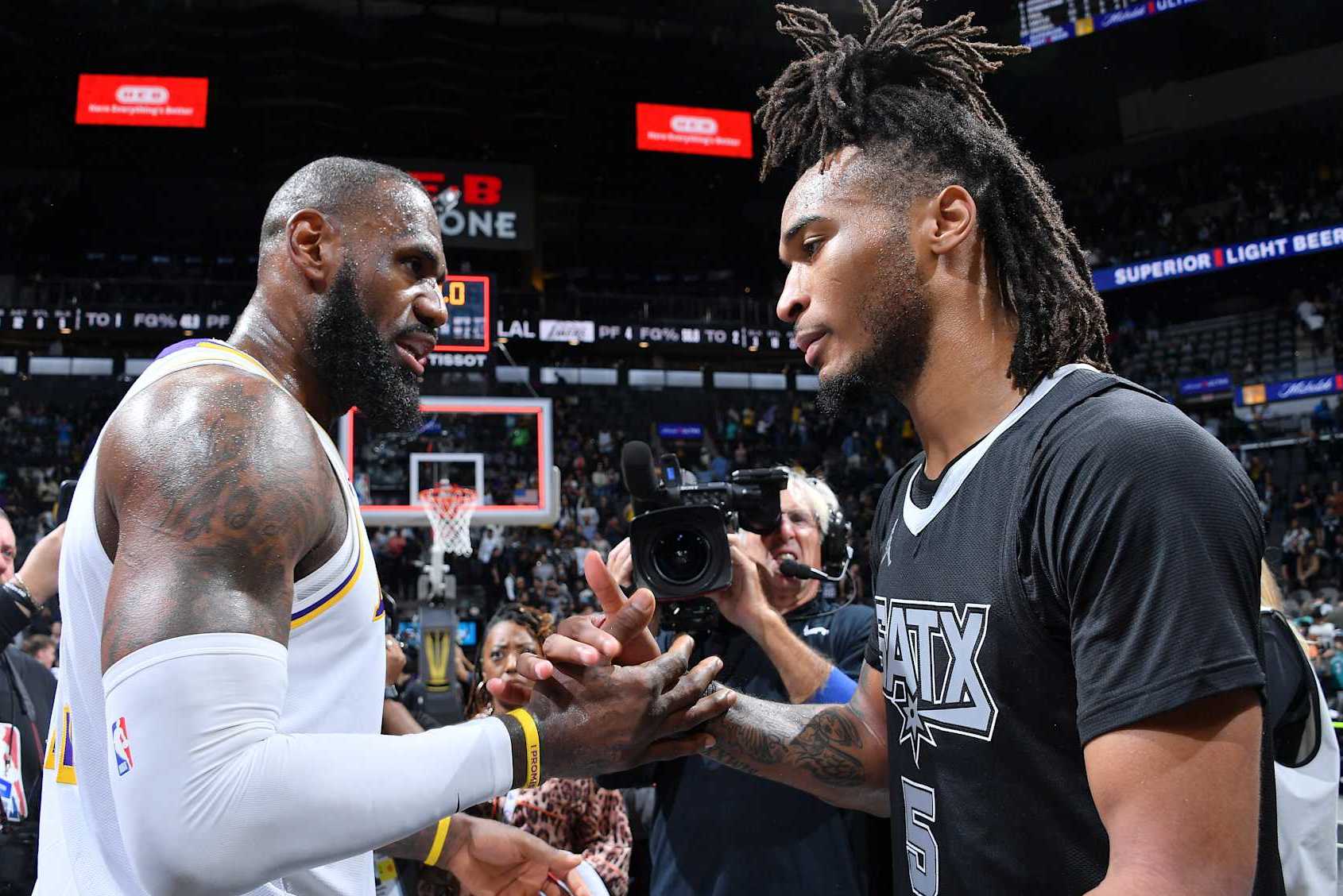 SAN ANTONIO, TX - OCTOBER 22:  LeBron James #23 of the Los Angeles Lakers speaks with Stephon Castle #5 of the San Antonio Spurs after the NBA Cup game on October 22, 2024 at the Frost Bank Center in San Antonio, Texas. NOTE TO USER: User expressly acknowledges and agrees that, by downloading and or using this photograph, user is consenting to the terms and conditions of the Getty Images License Agreement. Mandatory Copyright Notice: Copyright 2024 NBAE (Photos by Michael Gonzales/NBAE via Getty Images)