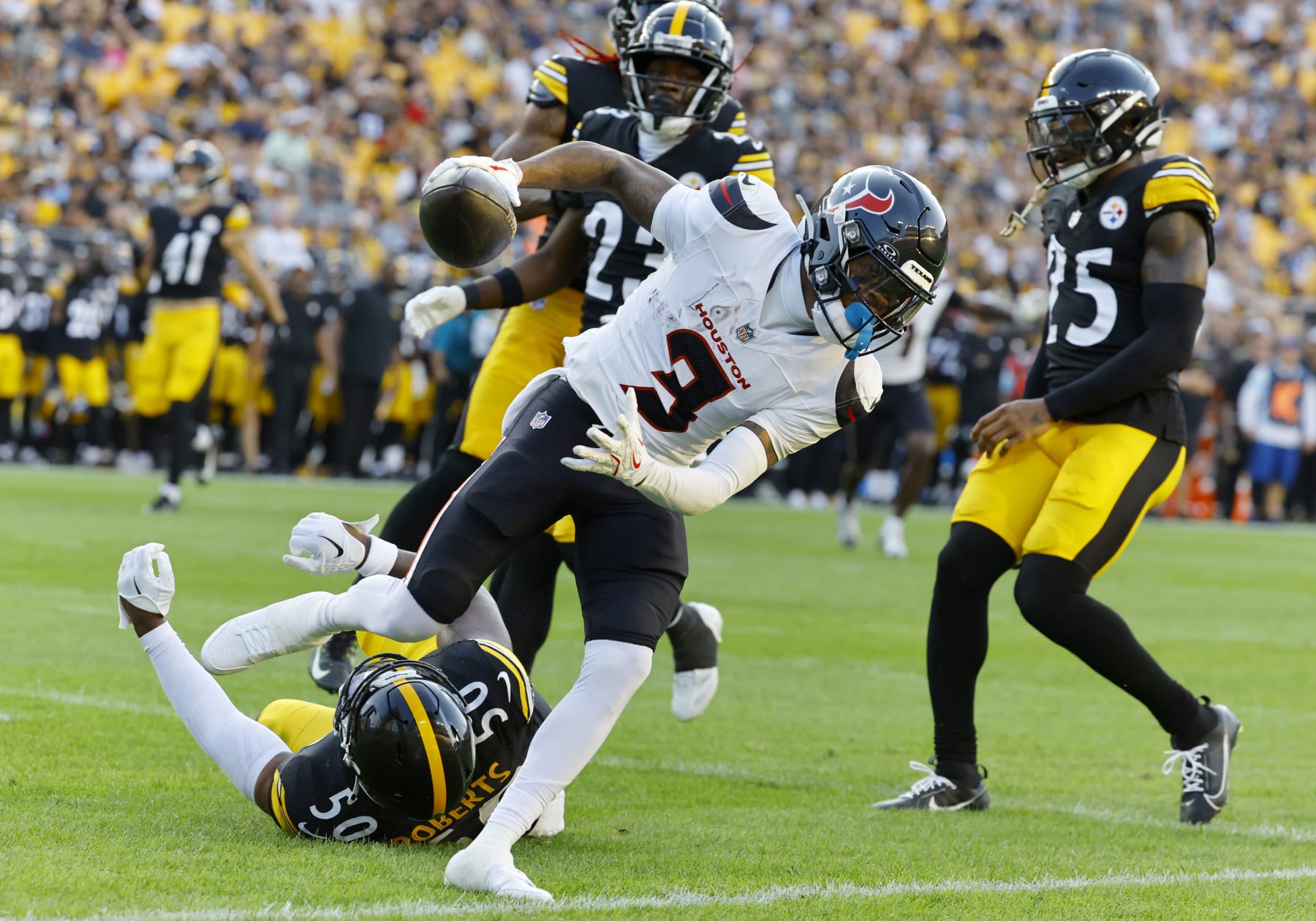 Houston Texans wide receiver Tank Dell scores a touchdown Friday against the Pittsburgh Steelers