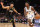 PHOENIX, ARIZONA - NOVEMBER 15: Anthony Edwards #5 of the Minnesota Timberwolves handles the ball against Devin Booker #1 of the Phoenix Suns during the first half of the NBA game at Footprint Center on November 15, 2023 in Phoenix, Arizona. NOTE TO USER: User expressly acknowledges and agrees that, by downloading and or using this photograph, User is consenting to the terms and conditions of the Getty Images License Agreement. (Photo by Christian Petersen/Getty Images)