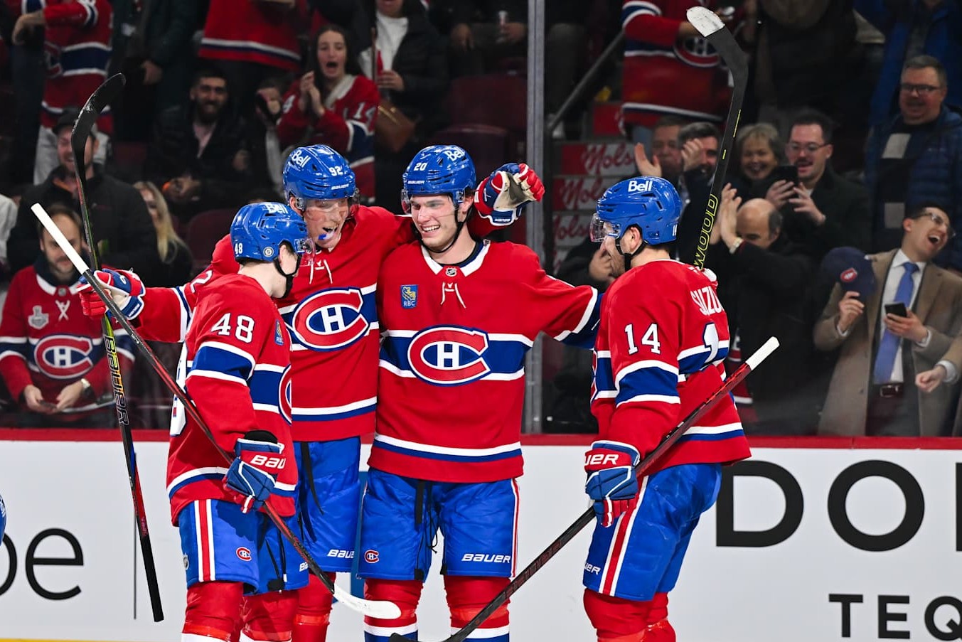 MONTREAL, CANADA - DECEMBER 17: Patrik Laine #92 of the Montreal Canadiens celebrates his hat-trick with teammates Cole Caufield #13, Lane Hutson #48, Juraj Slafkovsky #20 and Nick Suzuki #14 during the second period against the Buffalo Sabres at the Bell Centre on December 17, 2024 in Montreal, Quebec, Canada. (Photo by Minas Panagiotakis/Getty Images)