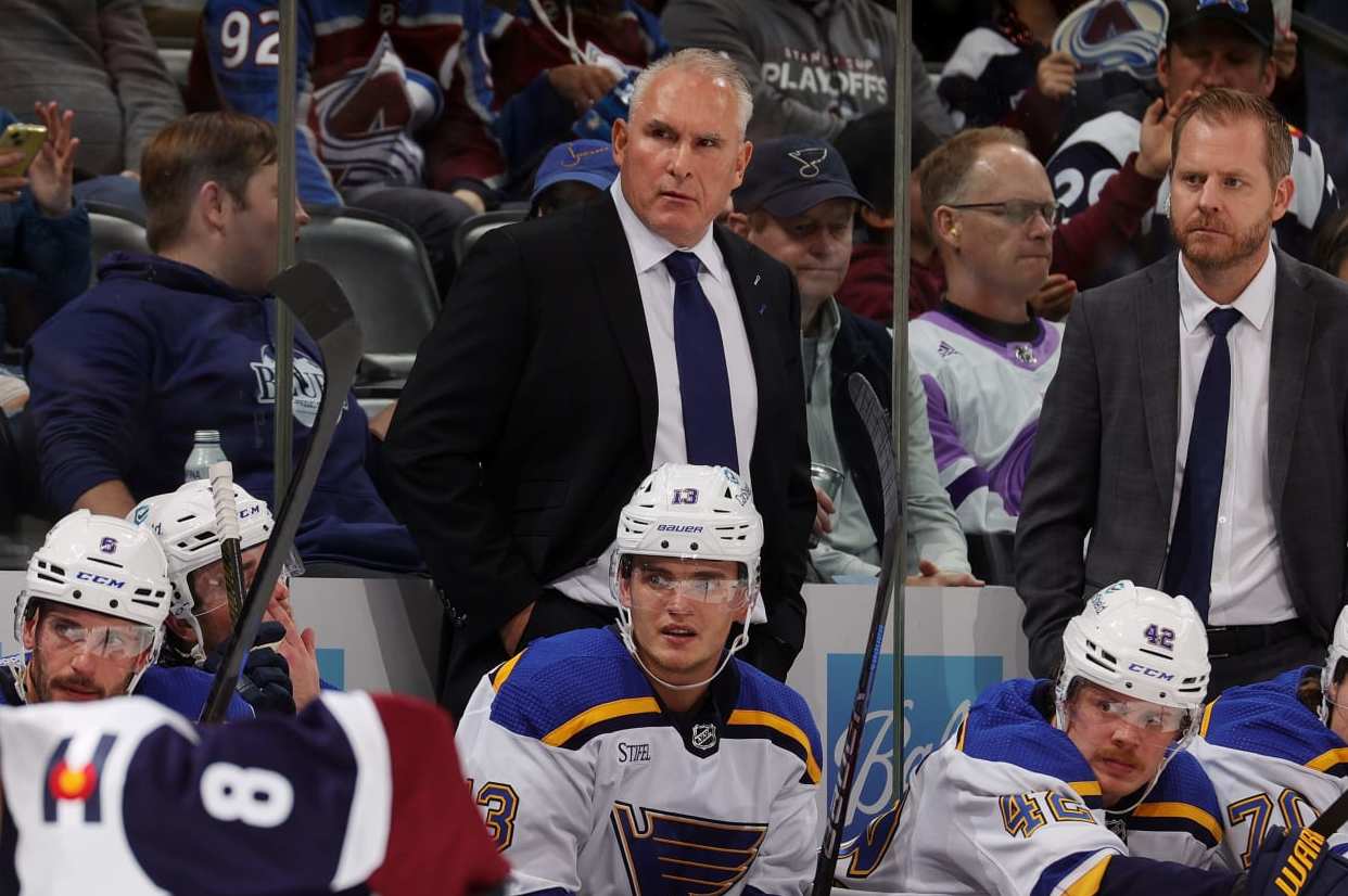DENVER, COLORADO - NOVEMBER 01: Coaching staff of the St. Louis Blues, Mike Weber, Craig Berube and Steve Ott, look on in the third period against the Colorado Avalanche at Ball Arena on November 1, 2023 in Denver, Colorado. (Photo by Michael Martin/NHLI via Getty Images)